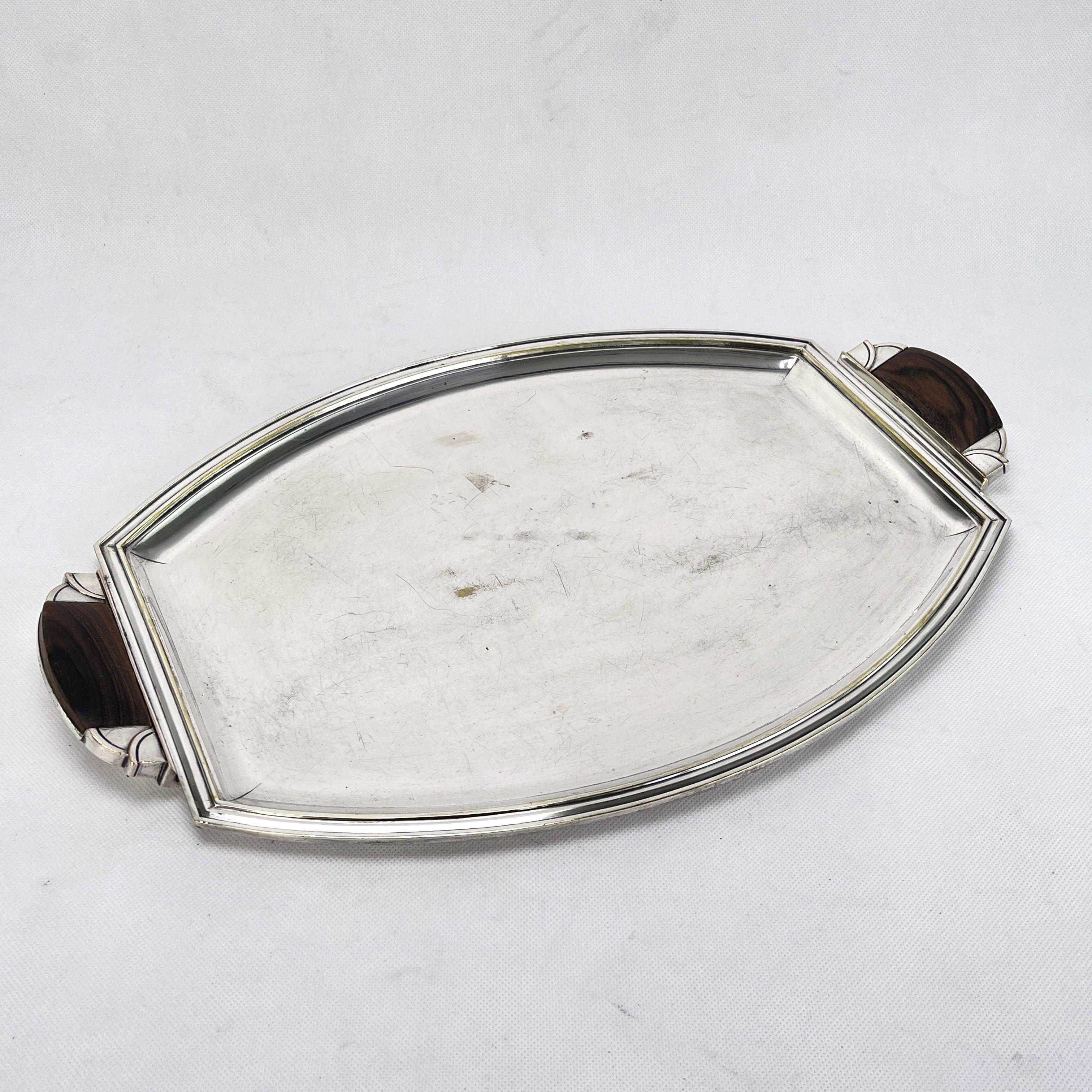 ART DECO Silver Plated Tray, 1930s

This beautiful tray from the 30s is in the style of streamline modern art deco. This style emphasized curvy streamlined shapes. The heavy tray still captivates with it's beautiful straight shape.

The cleaned