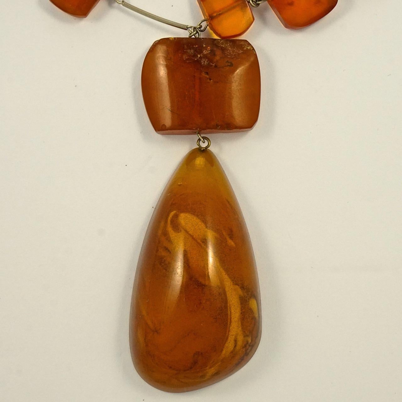 Fabulous silver tone link necklace with a double strand of polished amber beads, and a lovely large amber drop. Inside the drop are hundreds of tiny air bubbles. The longest strand is length 79cm / 31.1 inches, and the drop is length 6.2cm / 2.4