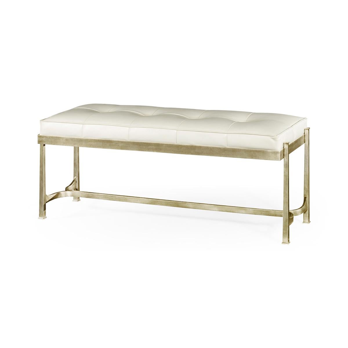 Art Deco Silvered Bench, an Art Deco inspired wrought iron rectangular bench with an antique silver finish and tufted cream leather boxed upholstery cushion.

Dimensions: 48