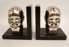 Art Deco Silvered Bronze Baby Bust Bookends. 1920´s