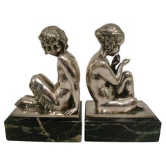 Serre-livres Art Déco en bronze argenté représentant un satyre et une fille par Pierre Laurel, 1930