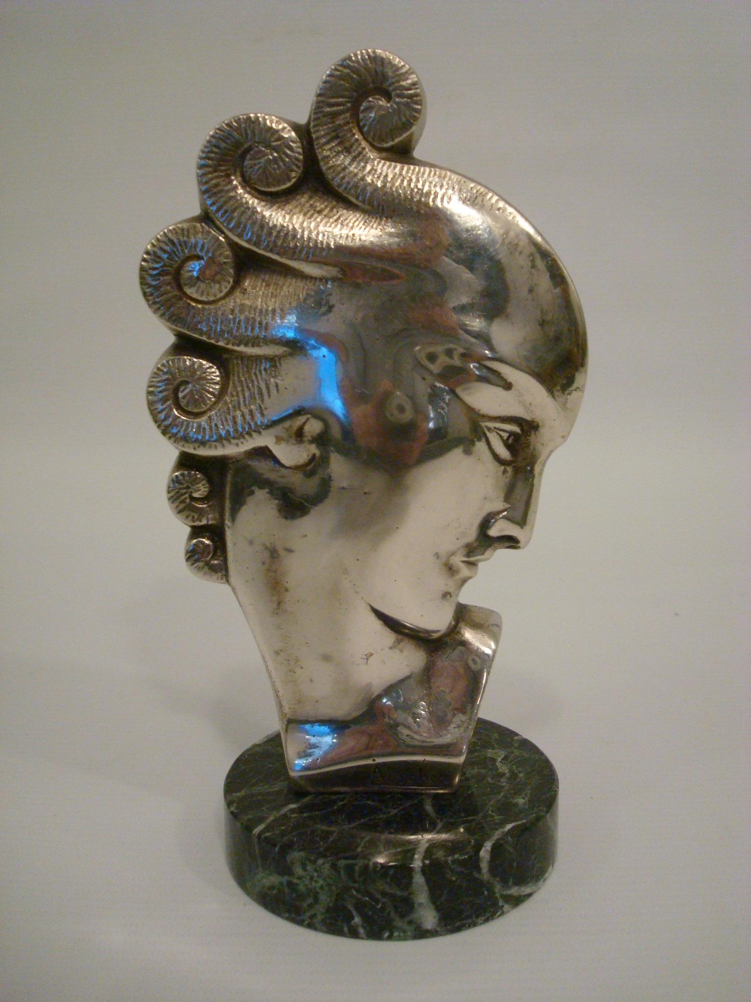 Art Deco bust of a woman. Silvered bronze sculpture of a moderniste lady.
Mounted over a Italian marble base. Signed on the base Auscher. France 1930
Perfect desk piece or paperweight.