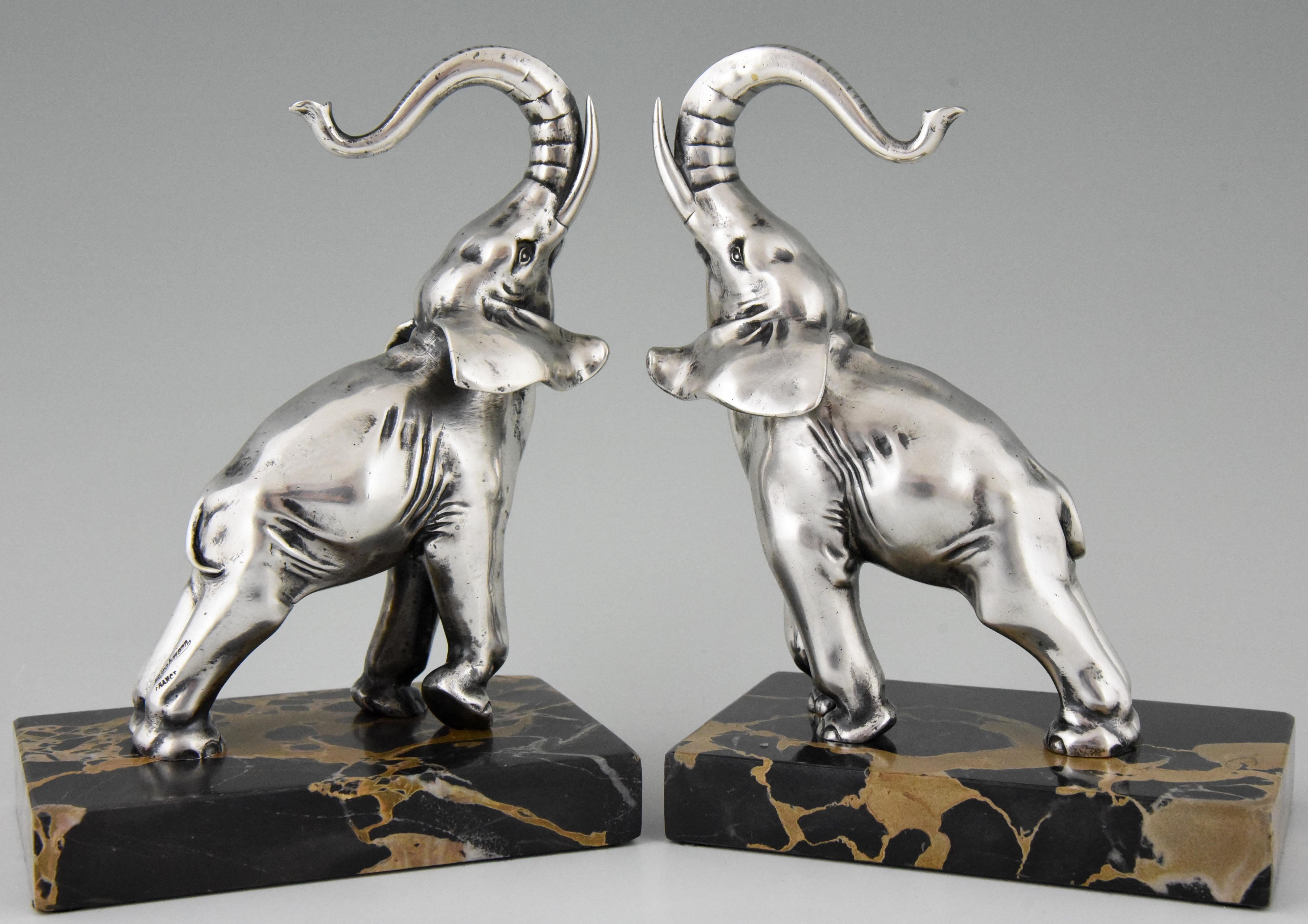 Very nice pair of silvered bronze elephant bookends signed by Rischmann, on a Portor marble base, France, circa 1925.
 