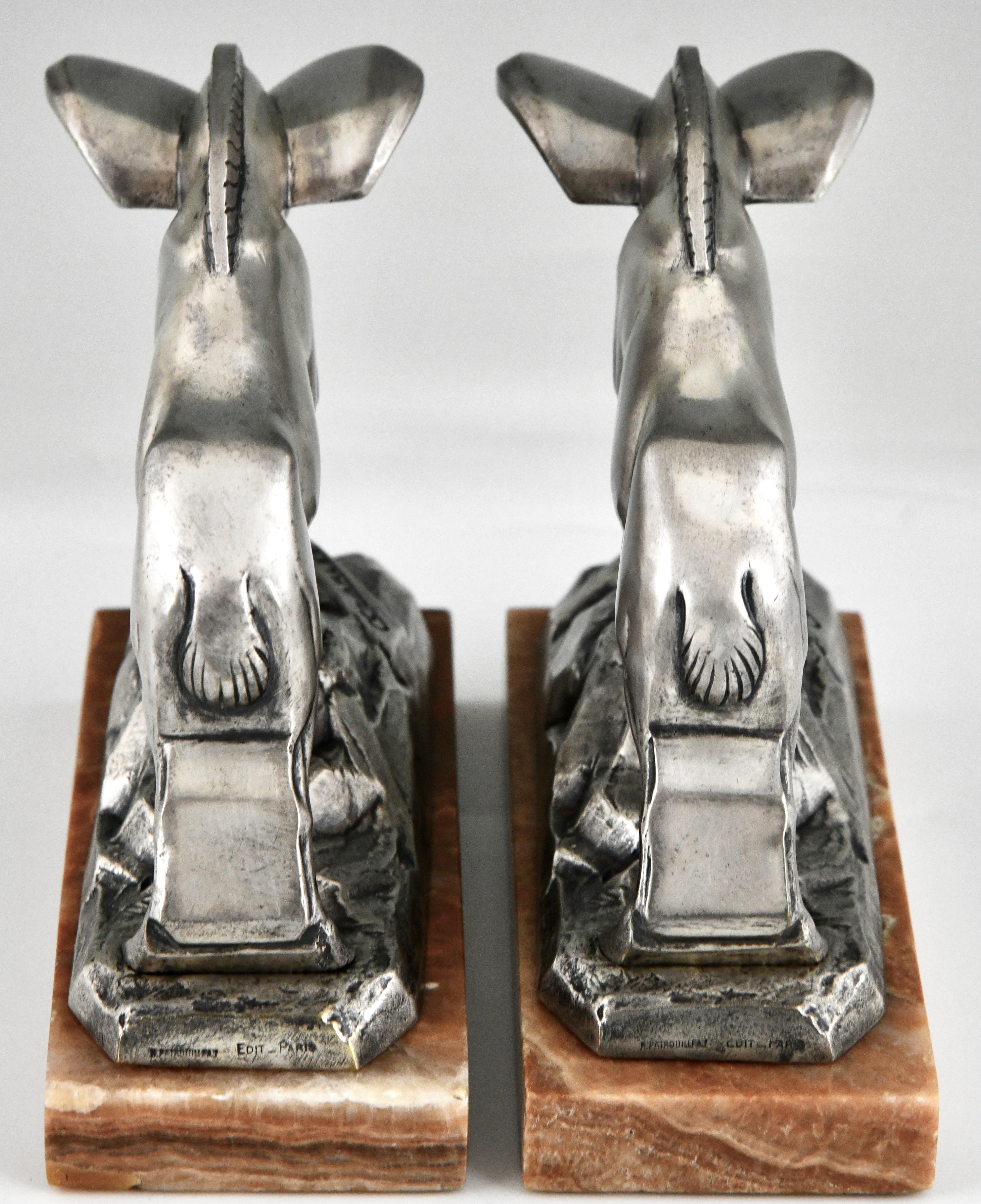 French Art Deco silvered bronze ibex bookends signed by C. Charles. For Sale
