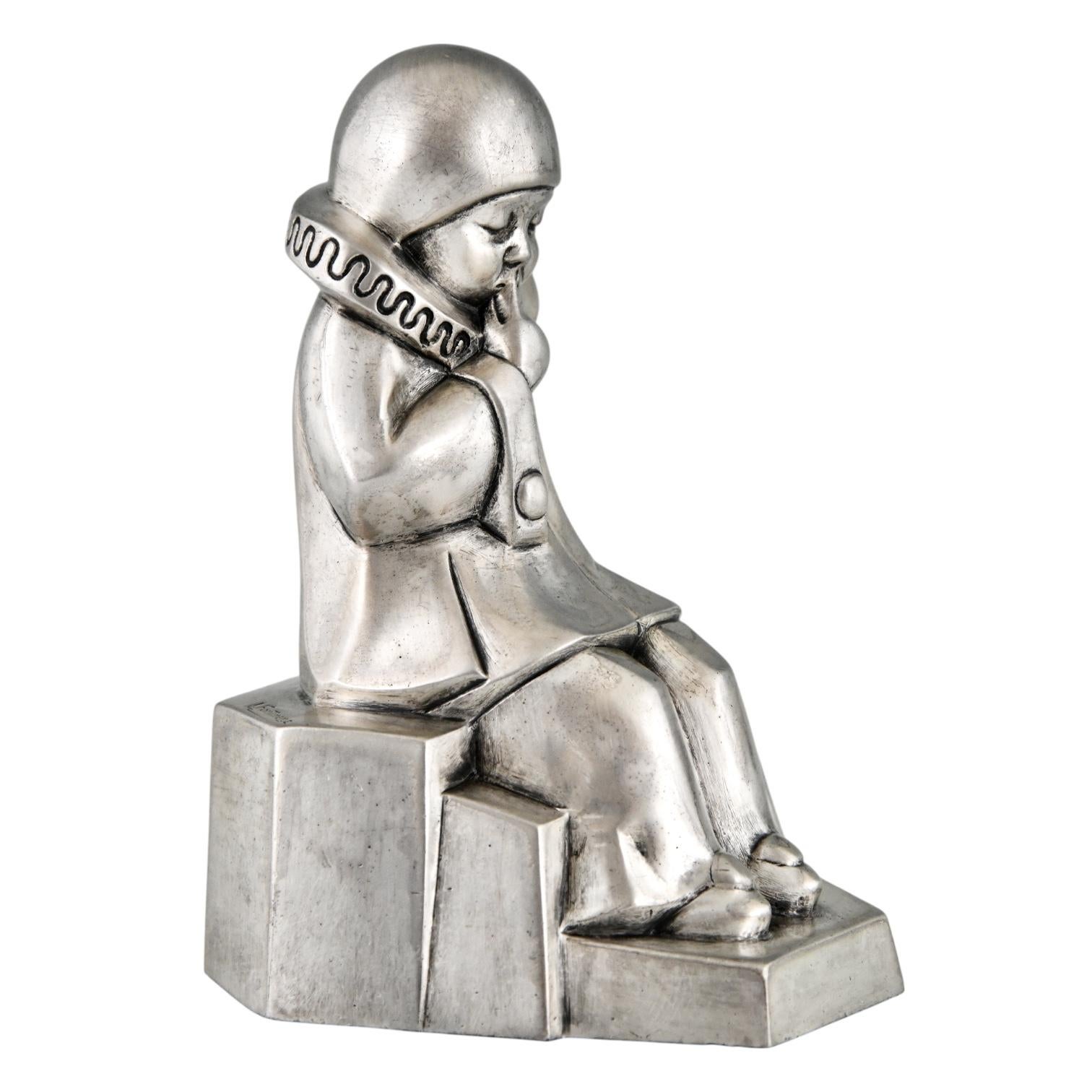 Early 20th Century Art Deco silvered bronze pierrot bookends by Jean de la Fontinelle. For Sale