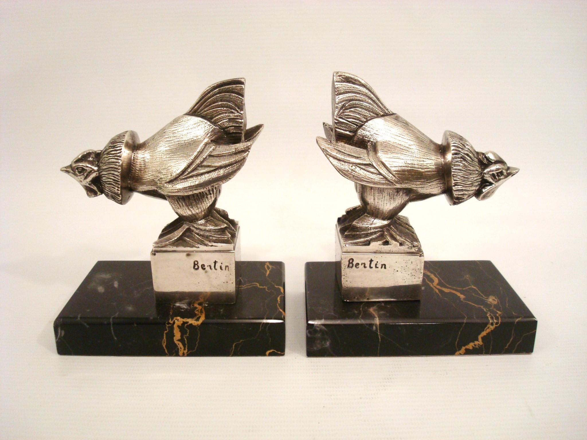 Art Deco Silvered Bronze Rooster Bookends. France 1920´s.
Signed by french artist Bertin. 
Silvered Bronze sculptures mounted over black and golden marble bases.
Excellent conditions.