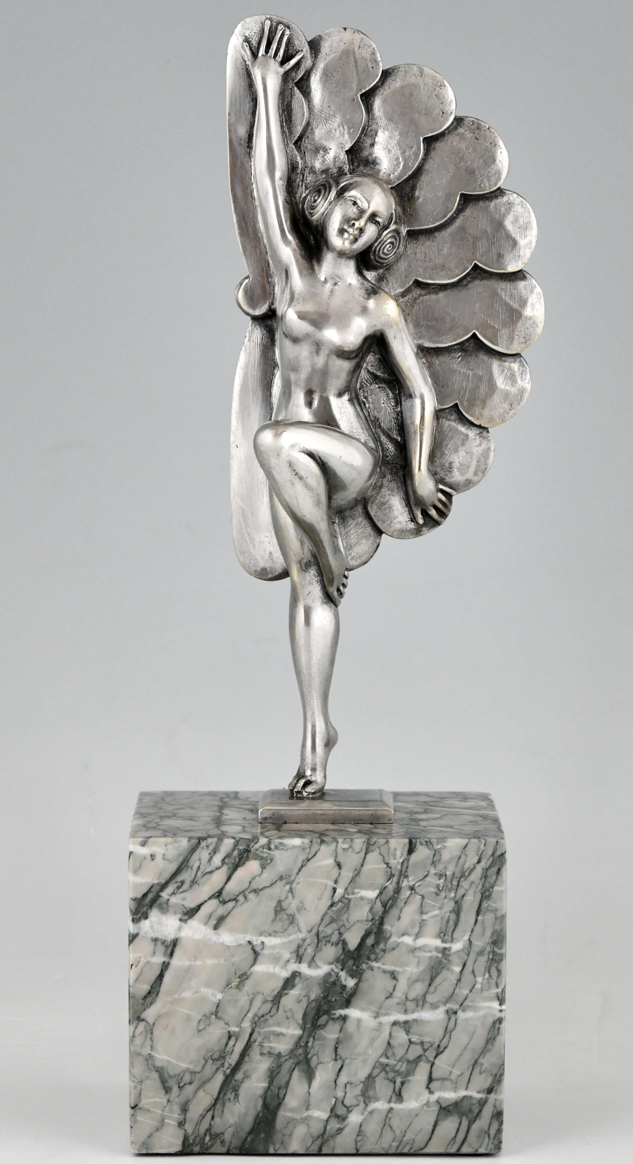 Art Deco sculpture in silvered bronze picturing a dancing lady with feathers. The bronze is signed by H. Molins and stands light green marble base, France 1925. 

“Art Deco and other figures” by Brian Catley, Antique collectors club. “Art Deco