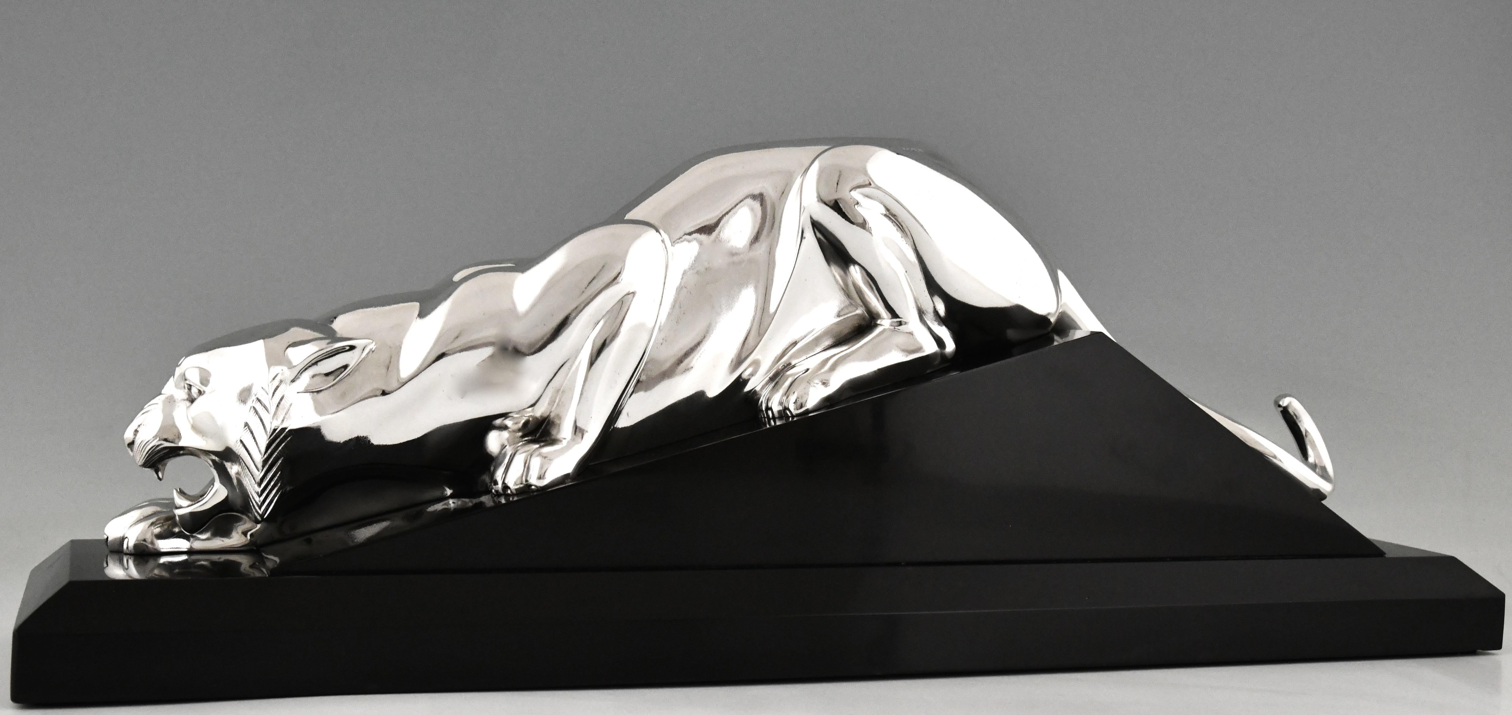 Art Deco silvered bronze sculpture of a panther by Georges Lavroff. 
The artist was born in Russia in 1895, lived and worked in France. 
The bronze statue is mounted on a Belgian Black marble base. France 1925.

This panther is illustrated in