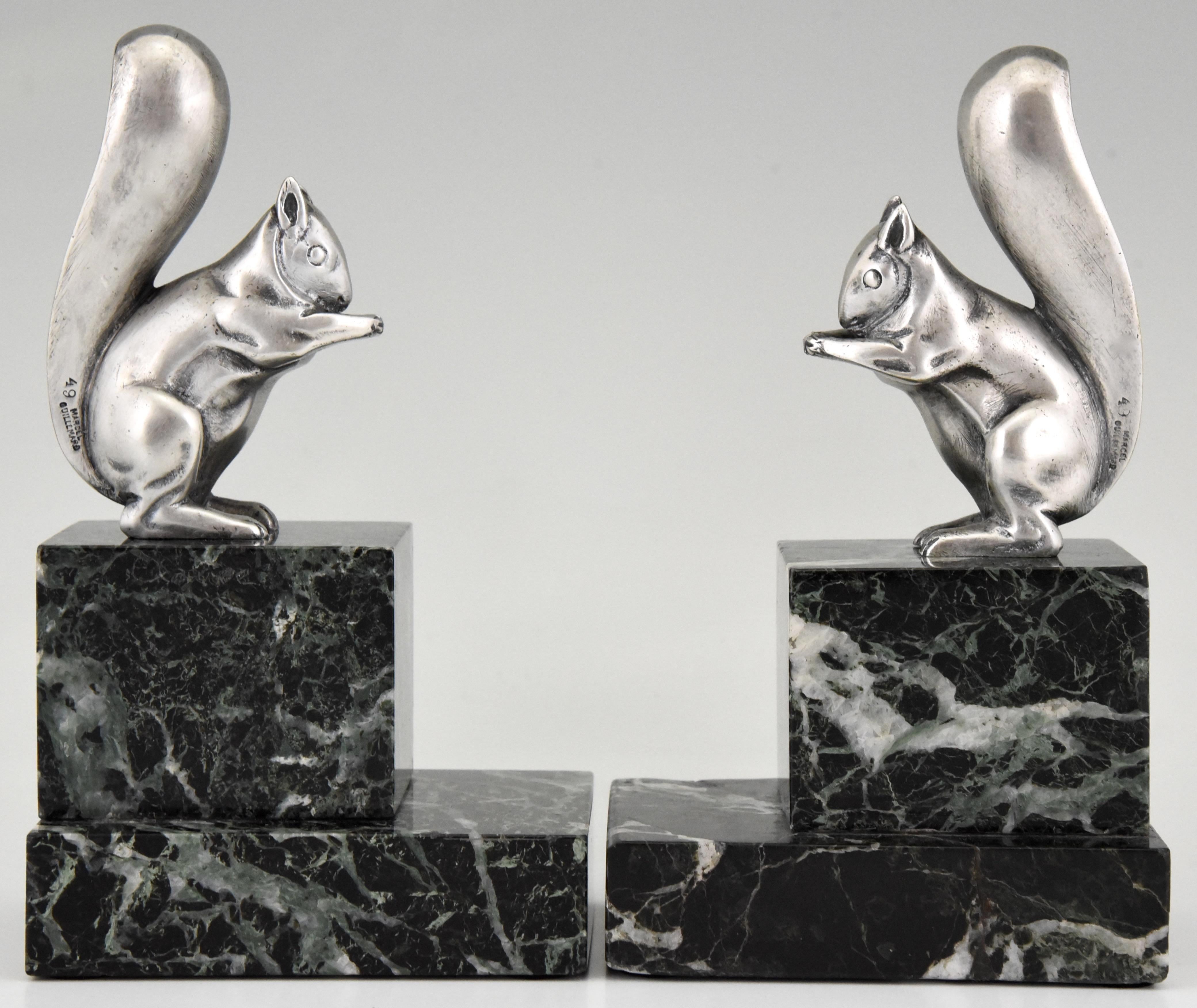 Cute pair of silvered bronze Art Deco bookends in the shape of squirrels. Signed by the French artist Claude and with the founders' signature of Marcel Guillemard. Mounted on marble bases, France, 1930.

“Dictionnaire illustré des sculpteurs
