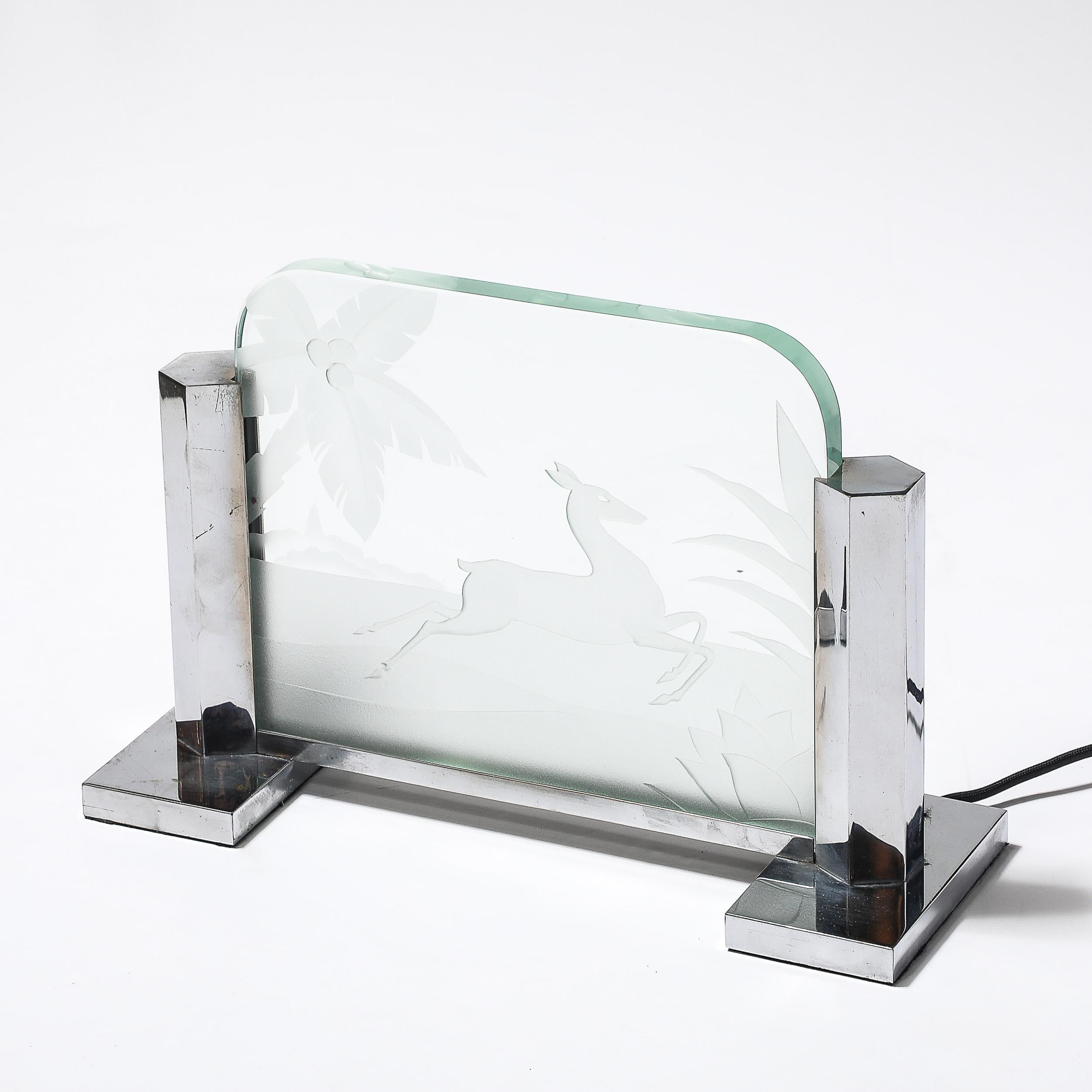  This elegant Art Deco table lamp, crafted in France circa 1930, is a striking example of early 20th-century design, blending intricate craftsmanship with bold artistic motifs. Made of silvered bronze, the lamp is notable for its exquisite