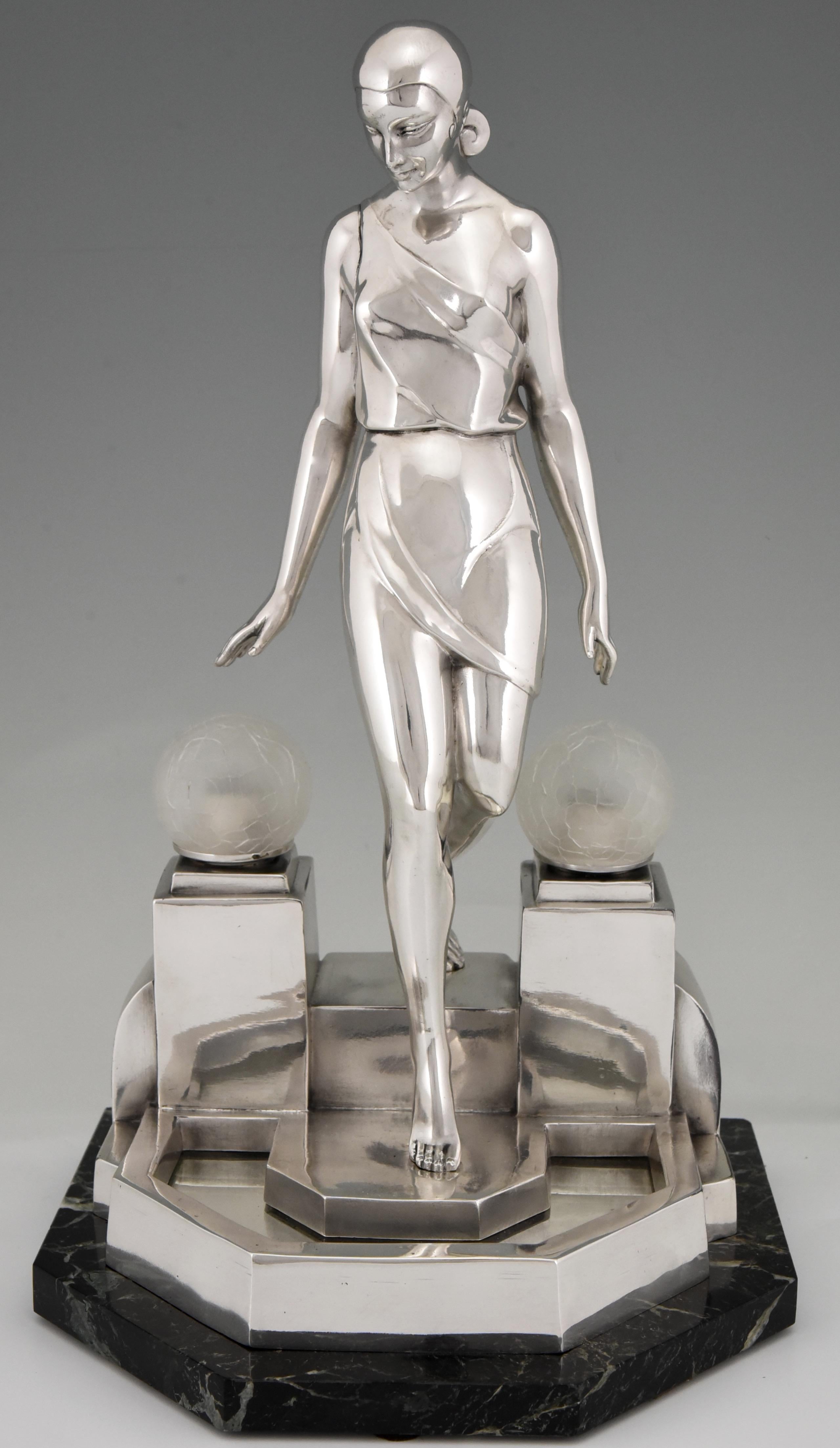 Stylish Art Deco sculptural table lamp by Pierre Le Faguays,
titled Nausicaa.
The lamp is a picturing a woman walking down a fountain, 
The sculpture is signed Fayral for Pierre Le Faguays and was cast by the Le Verrier foundry. The sculpture is