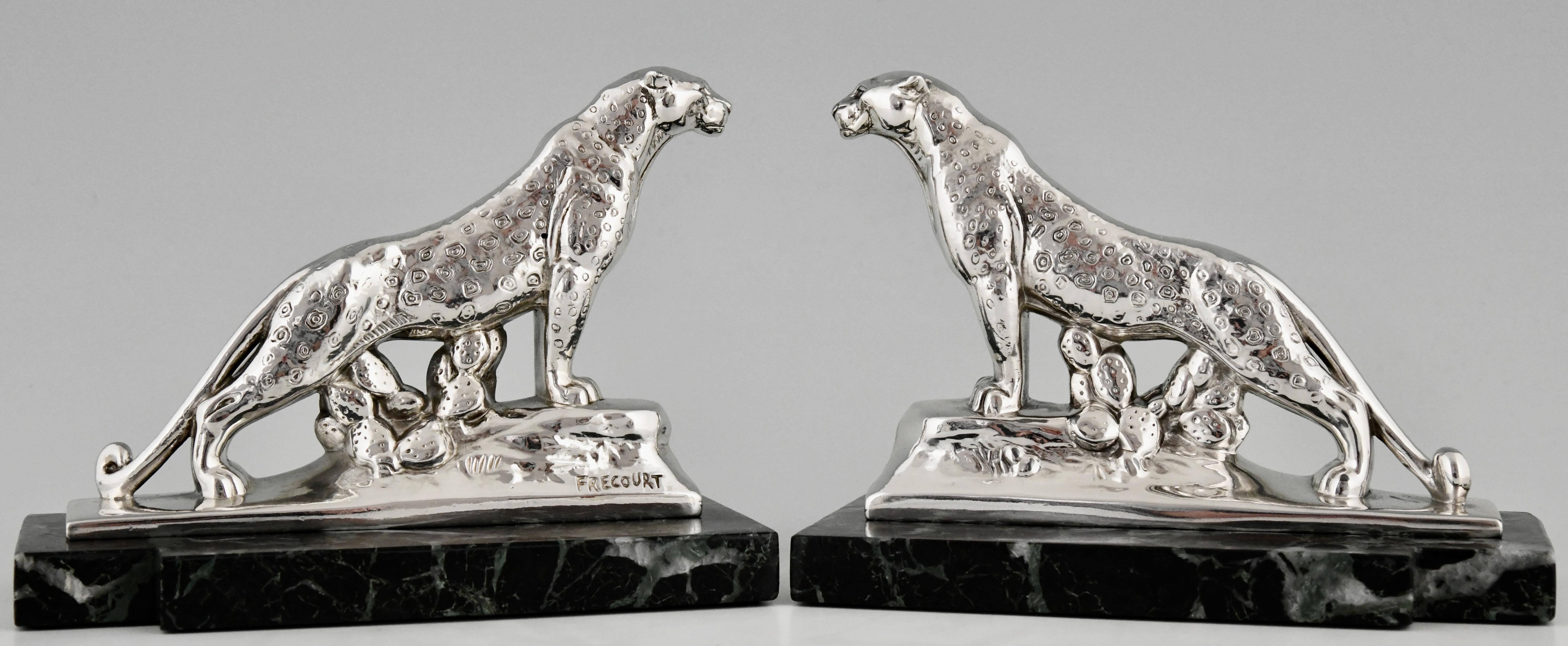 Stylish pair of Art Deco silvered panther leopard bookends signed by the French artist Maurice Frecourt, circa 1930. The sculptures are mounted on fine Portor green bases.

Literature:
	
Dictionnaire des peintres,sculpteurs,dessinateurs et graveurs