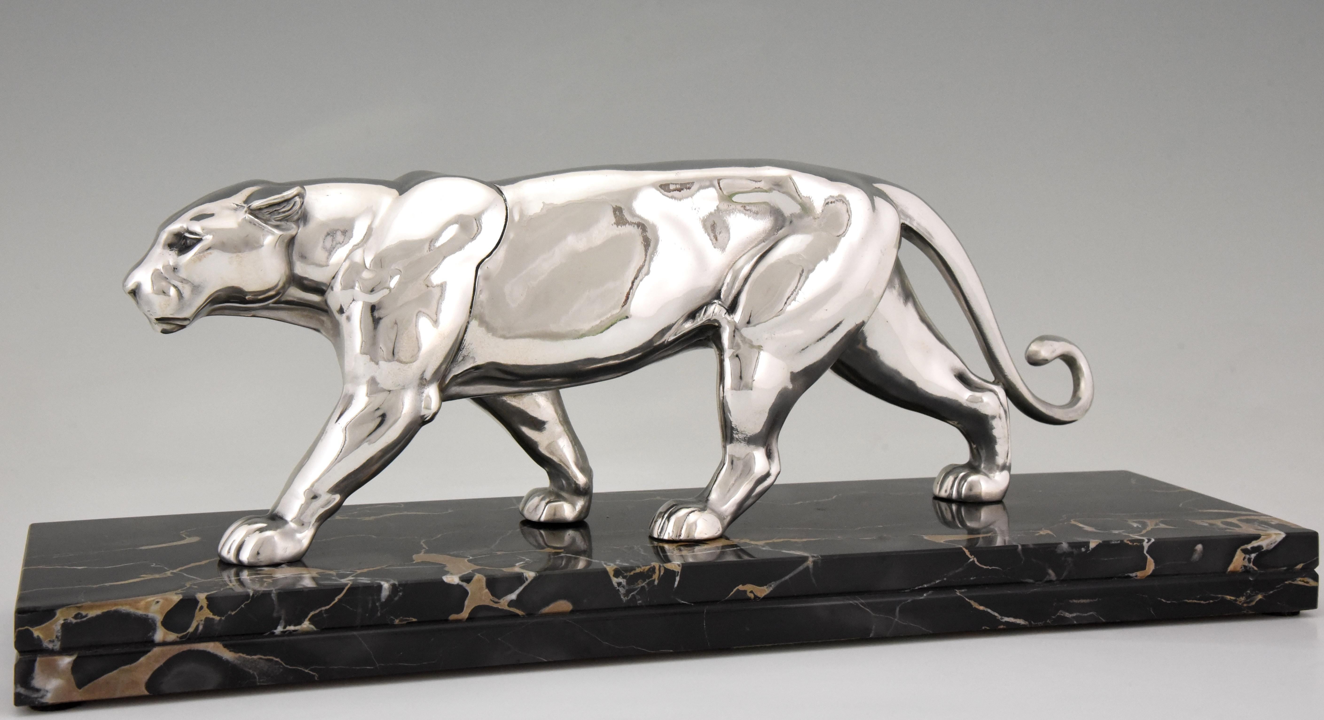 Art Deco sculpture of a panther by Alexandre Ouline. The silvered art metal sculpture stands on a Portor marble base, France, 1930.
Literature:
“Animals in bronze” by Christopher Payne. Antique collectors club. ?“Dictionnaire des peintres,
