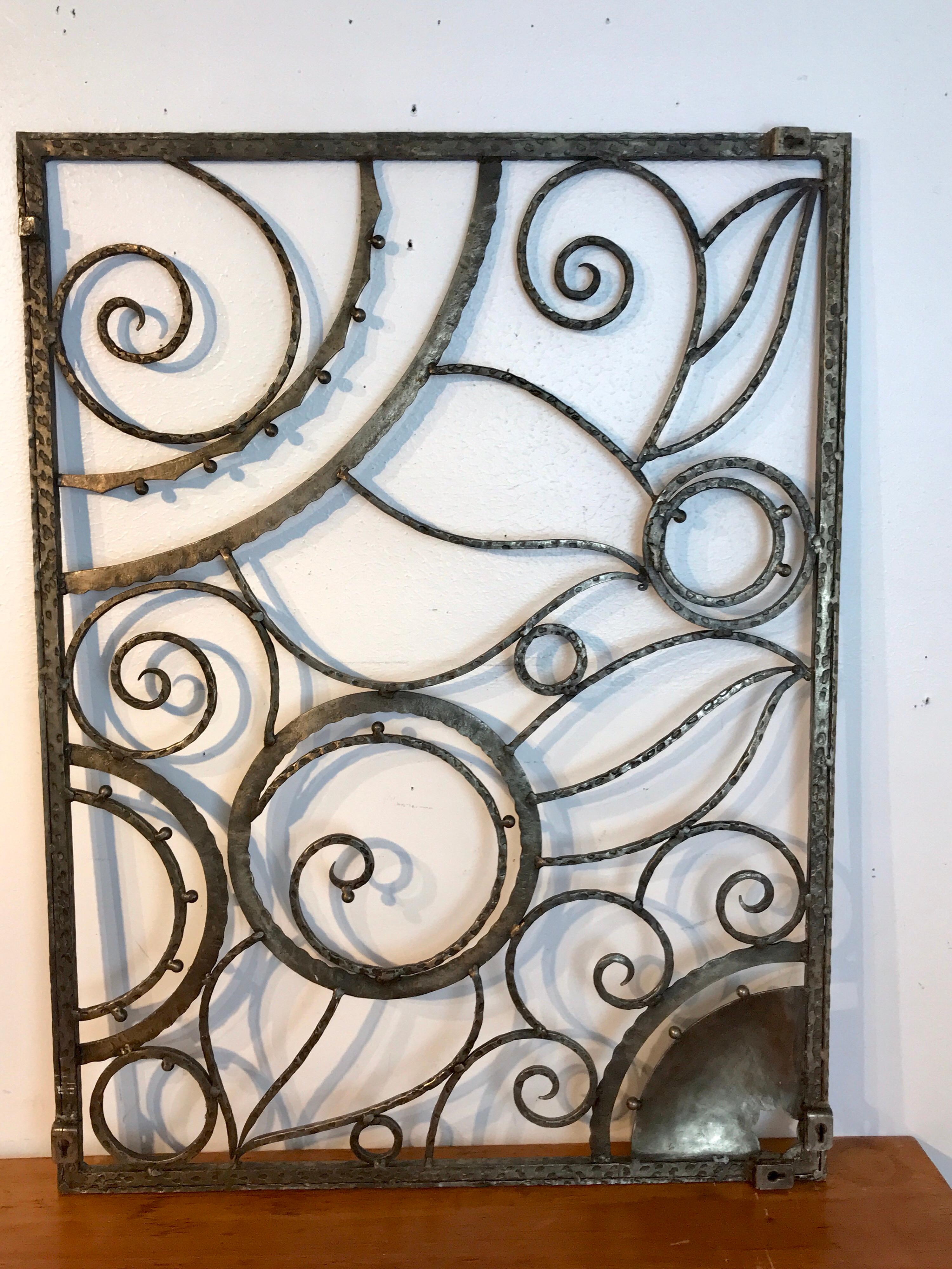 Art Deco silvered wrought iron grate after Edgar Brandt, of stylized leaves and flowers, can be hung vertically or horizontally. Unmarked.