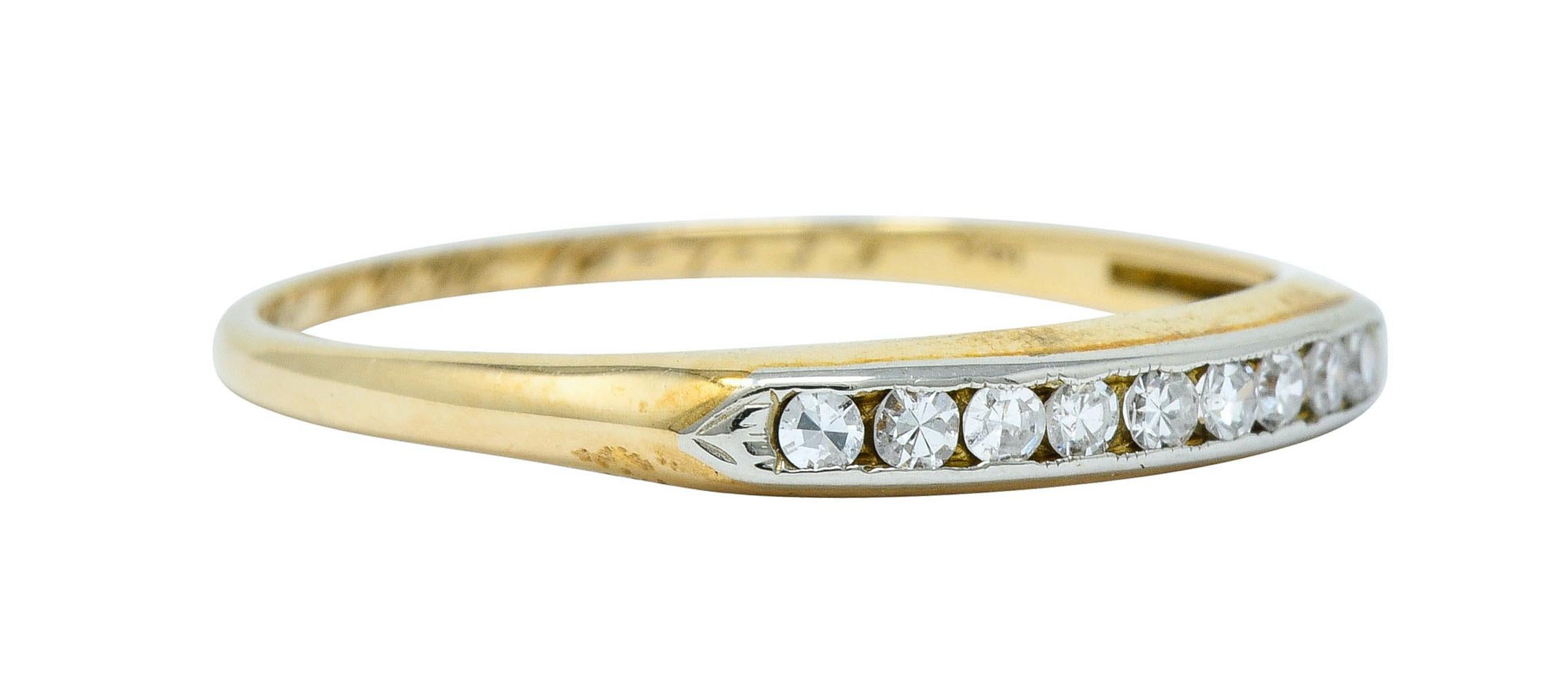 Thin band ring features nine single cut diamonds, channel set in white gold

Weighing approximately 0.20 carat with G to I color and VS clarity

Completed by pointed shoulders and a knife edged shank

Stamped 14K for 14 karat gold

With a dated