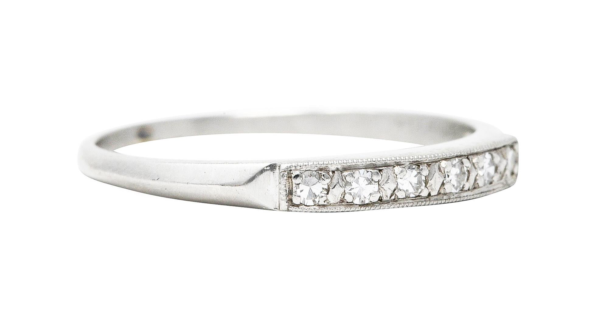 Band ring is set to front by six single cut diamonds

Weighing in total approximately 0.10 carat - eye clean and bright

With milgrain edges and subtle knife edge shoulders

Tested as platinum

Circa: 1930

Ring size: 8 1/4 and sizable

Measures