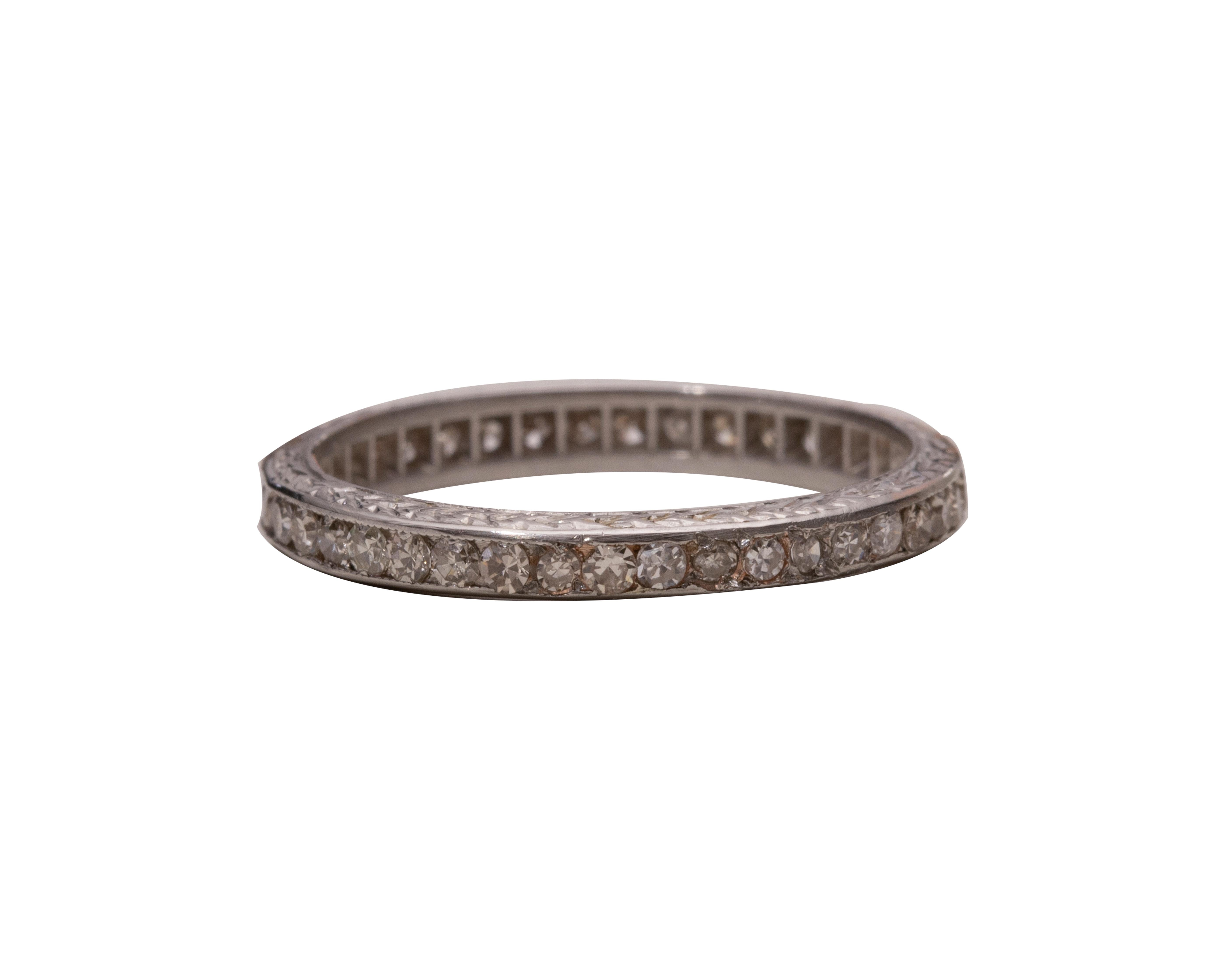 Here we have a sparkling diamond eternity wedding band from the 1920's!  Crafted in platinum this excellent example of an early eternity band is absolutely gorgeous! The antique single cuts are appropriate for the era and are nested securely in the