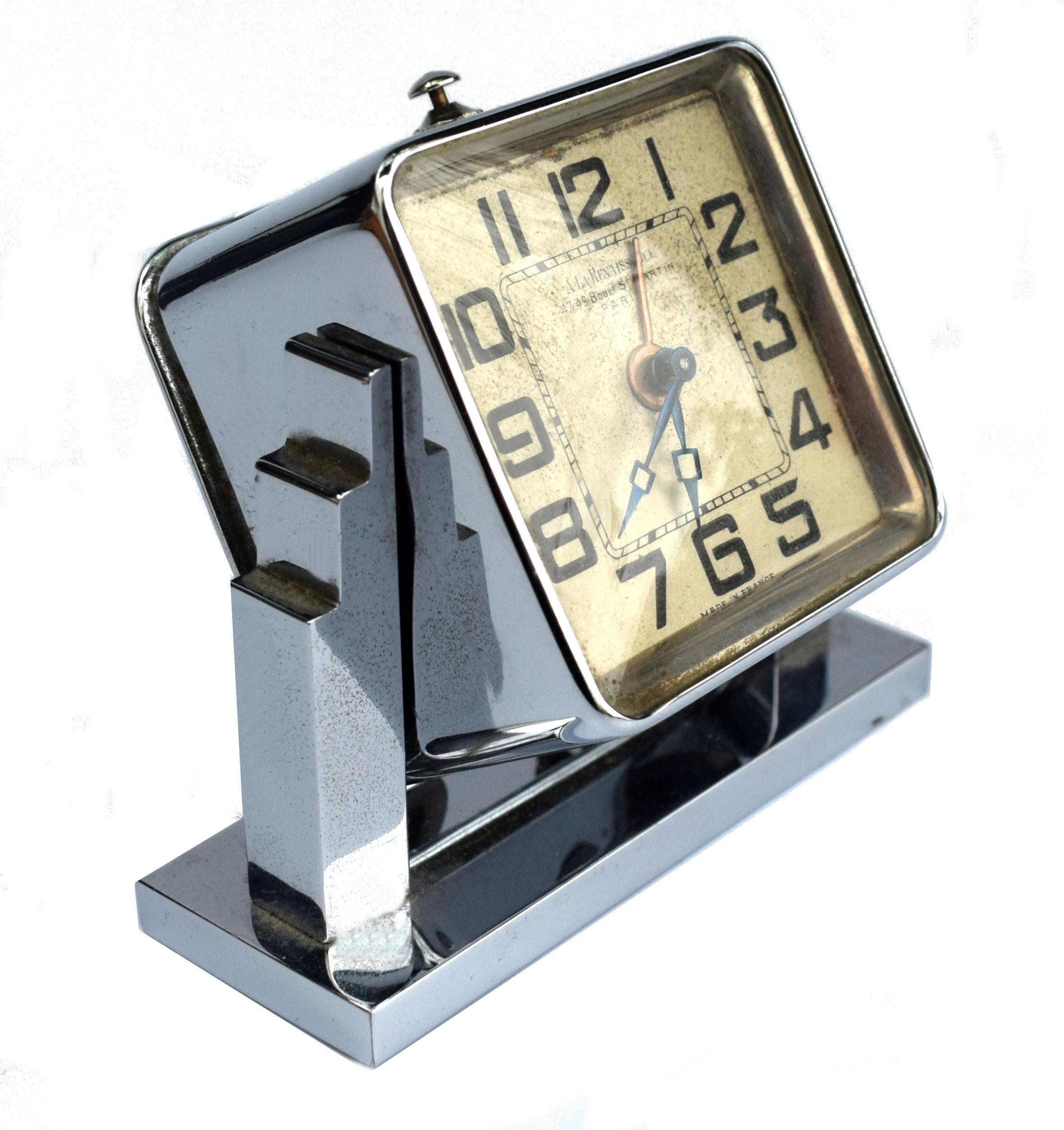 For your consideration is this iconically designed little French Art Deco alarm clock still with it's original leather carry case. To the dial is written 'A LA Renaissance 47- 49 Boul St Martins Paris'. In the 1930s this was a largest and most
