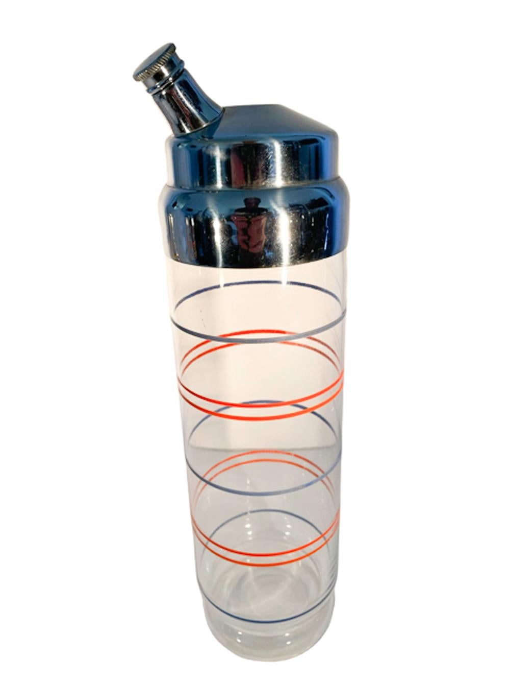 Tall cylindrical Art Deco cocktail shaker with a stepped foot decorated with alternating single blue and double orange rings and topped with a high domed chrome top with elongated off-center pour spout, together with six matching cocktail glasses.