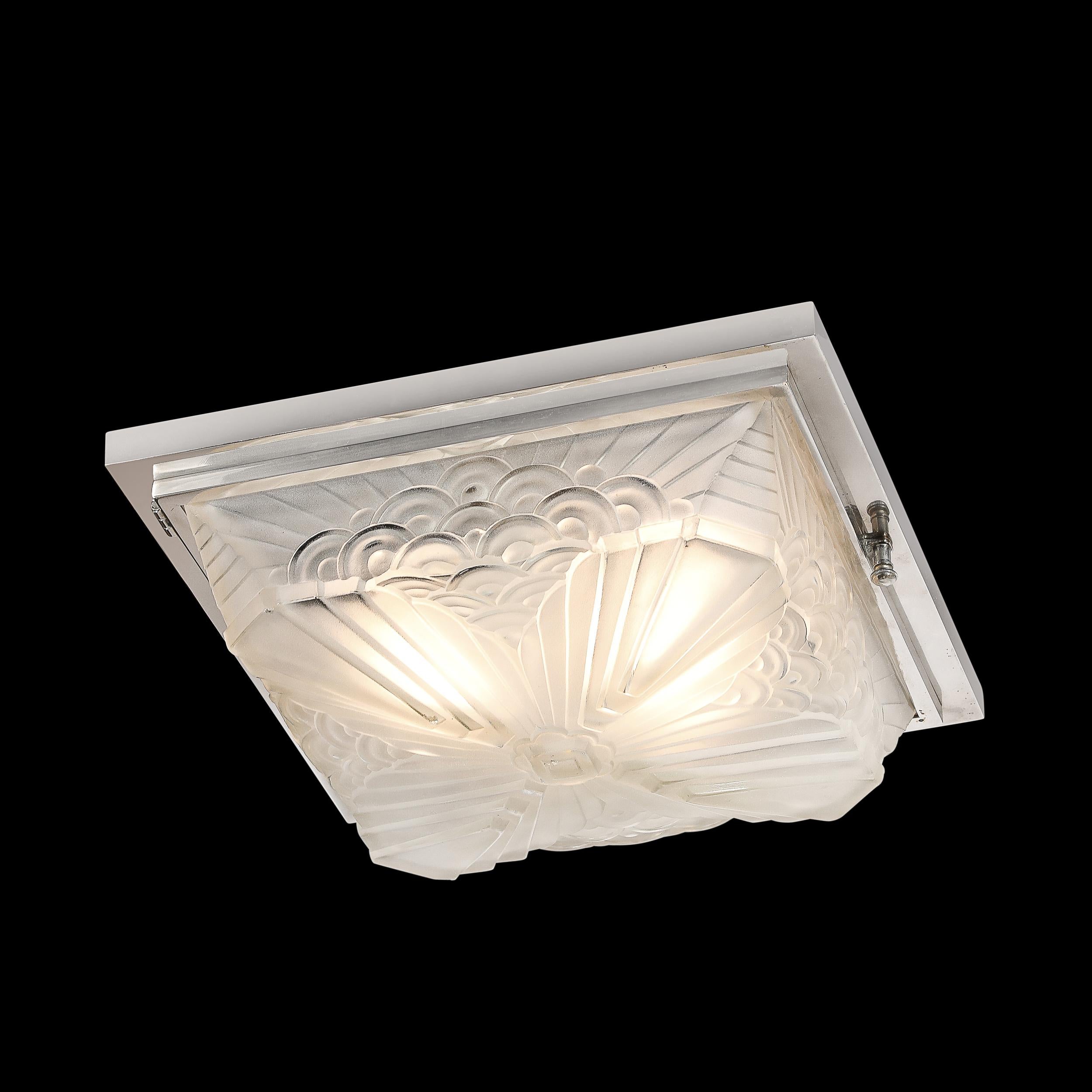 This beautifully achieved Art Deco Skyscraper Stylized Cubist Cloud form Flush Mount Chandelier by Schneider originates from France, Circa 1930. This brilliant piece features a single frosted glass shade with a stunning array of thoughtfully