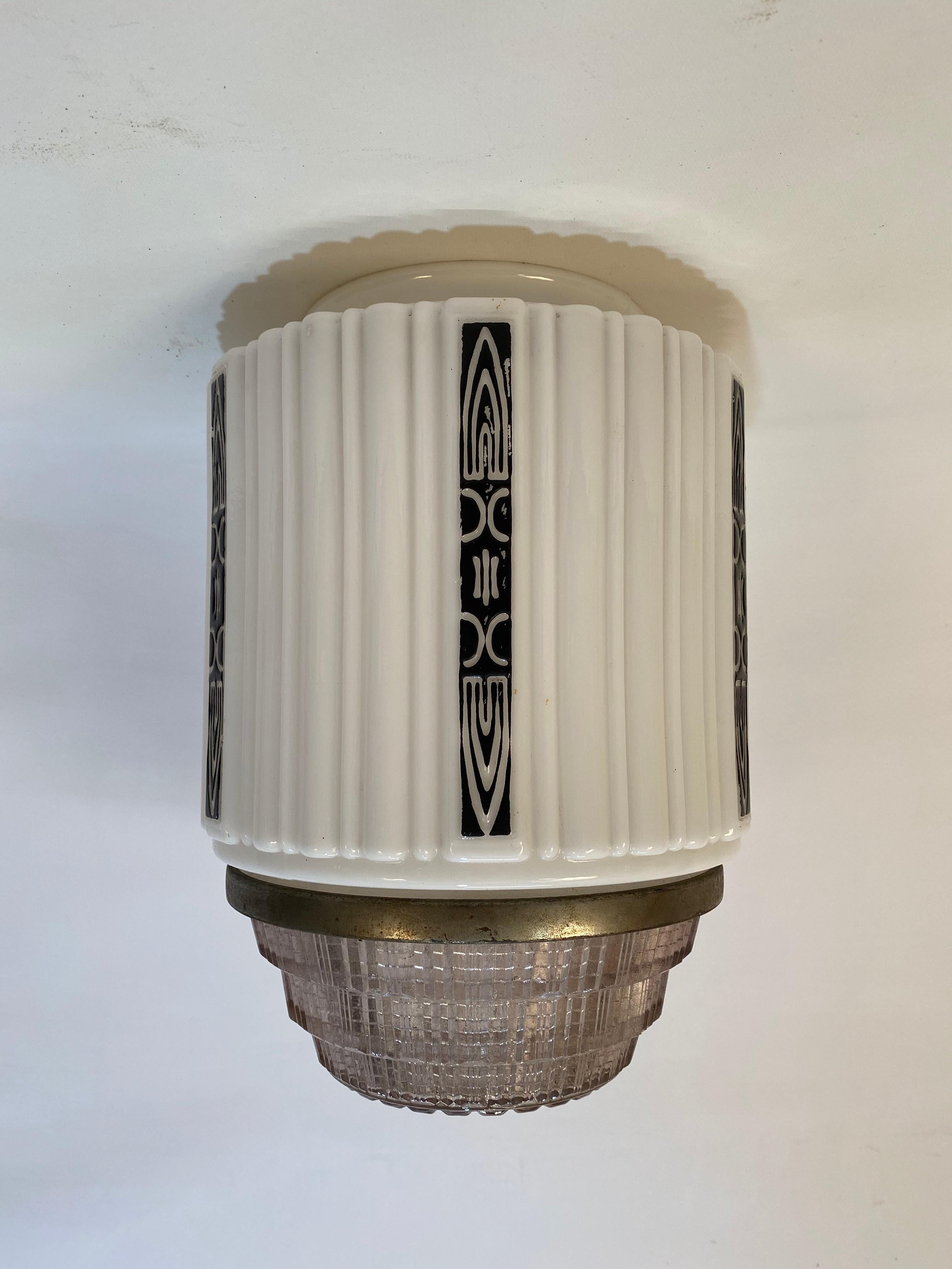 Art Deco milk glass light fixture flushmount shade. Wonderful skyscraper style scalloped glass shade. Clear glass homophone removable shade on the bottom (the wing nut loosens the metal band for light bulb replacement). Black on white linear design,