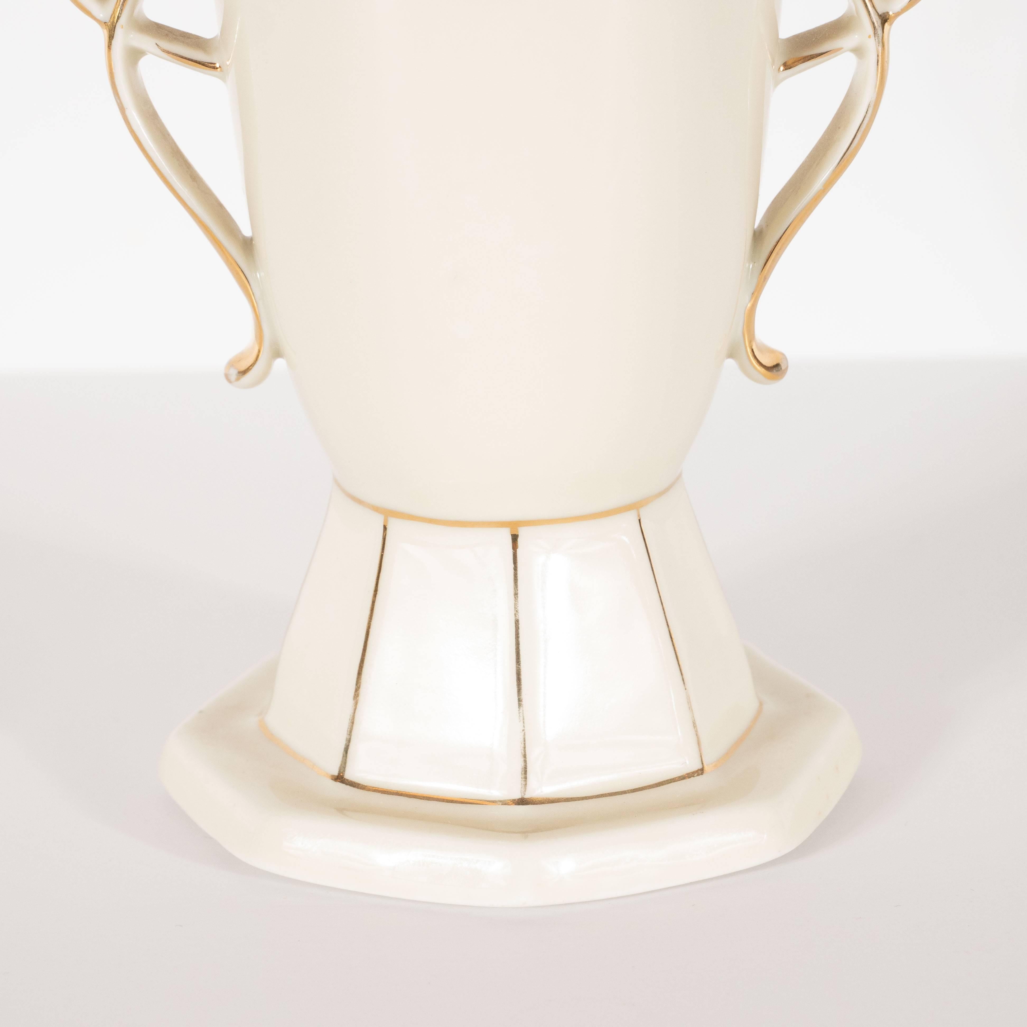 This stunning and dramatic vase was realized in Czechoslovakia- a country known for producing some of the finest quality glass and porcelain products of this era- circa 1930. It features an octagonal base that tapers upwards- the perimeter form of