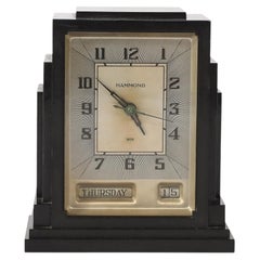 Reloj eléctrico Hammond de baquelita, estilo rascacielos Art Déco, con función de día y fecha