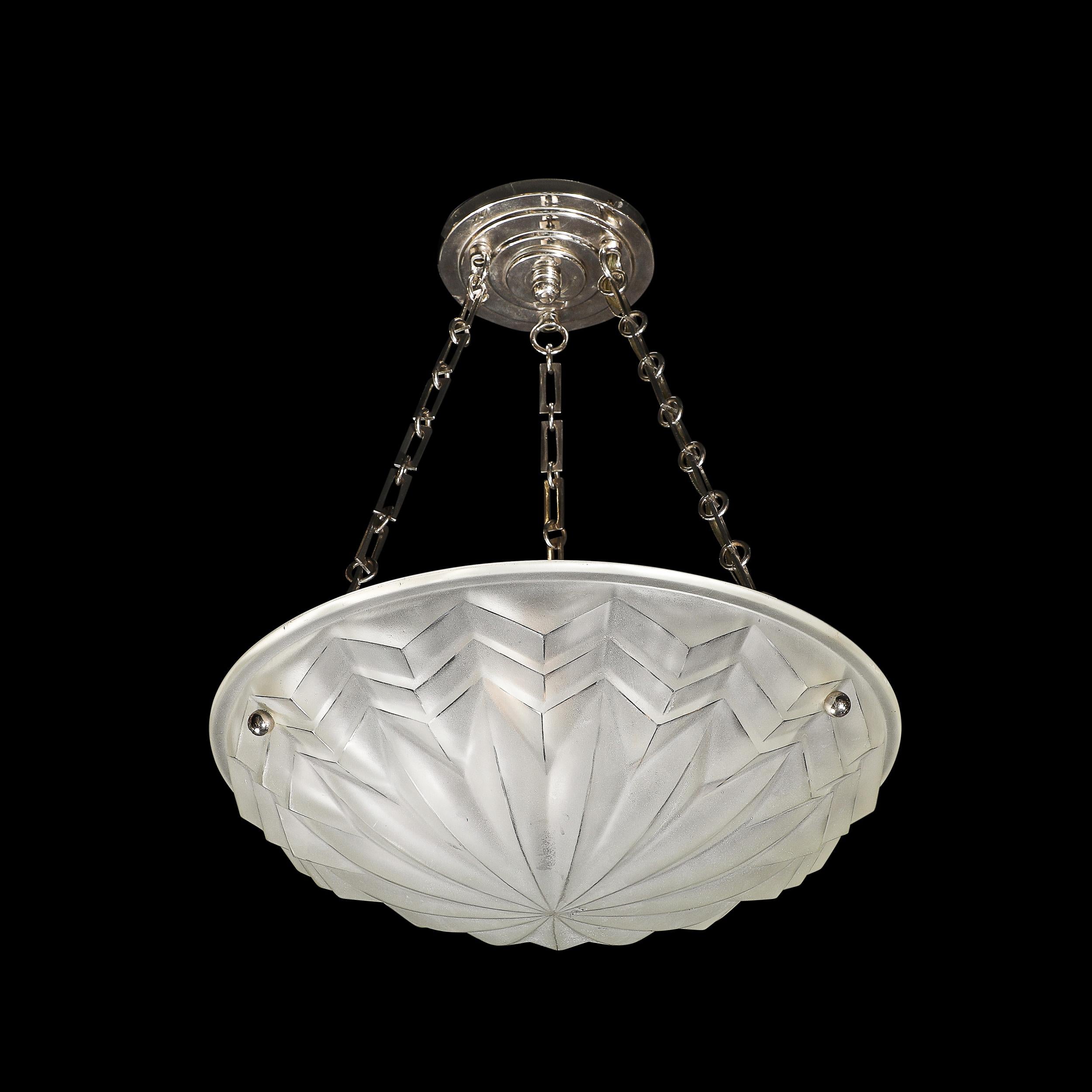 This highly elegant and sophisticated Art Deco Skyscraper Style Molded & Frosted Glass Pendant Chandelier originates from France, Circa 1930. Features a stunning skyscraper style starburst cubist motif expanding from the base of the fixture, with a