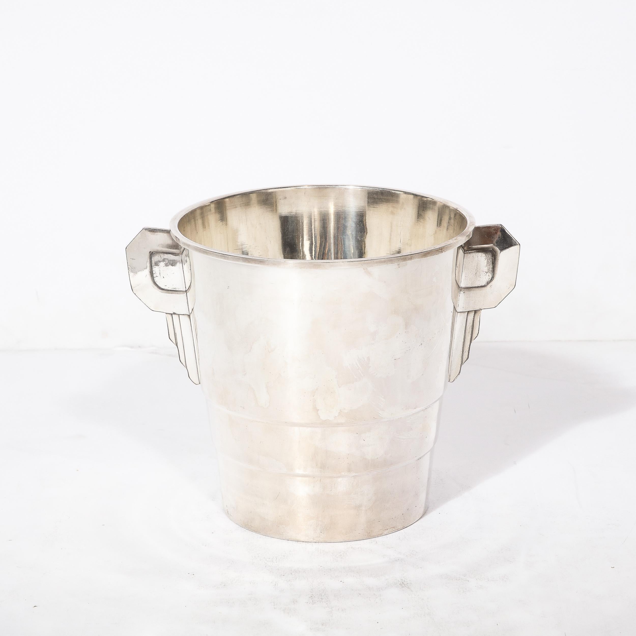 This Art deco Skyscraper Style Silver Plate Ice Bucket Originates from France, Circa 1930. Unique and beautifully designed, the piece is highly characteristic of the Art Deco era and utilizes skyscraper tiering and a balance of gradual and well