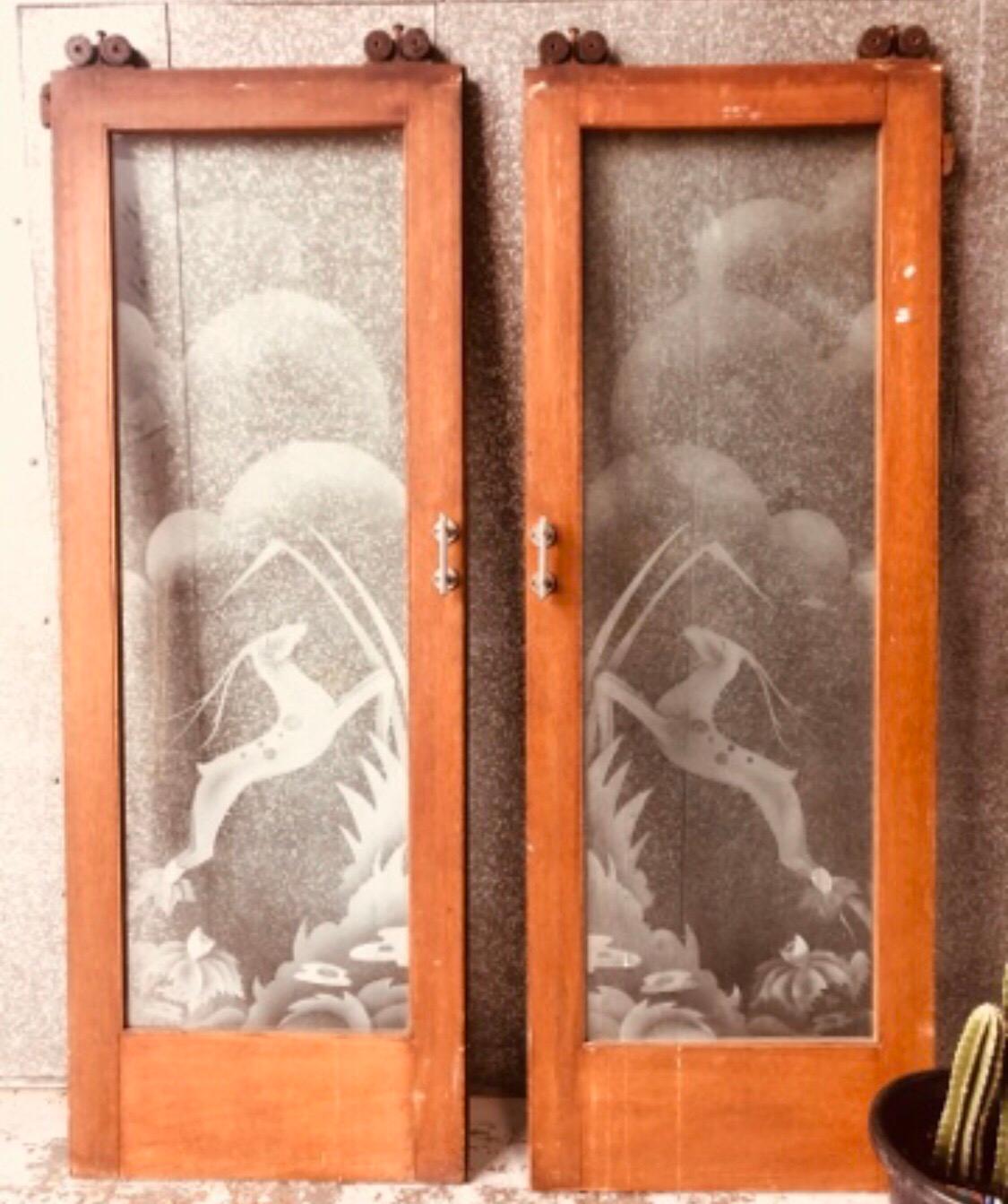 Art Deco acid etched doors with impala design
Original oak door frames, chrome handles and metal rollers
Each door is 76 cm wide and 219 cm high.