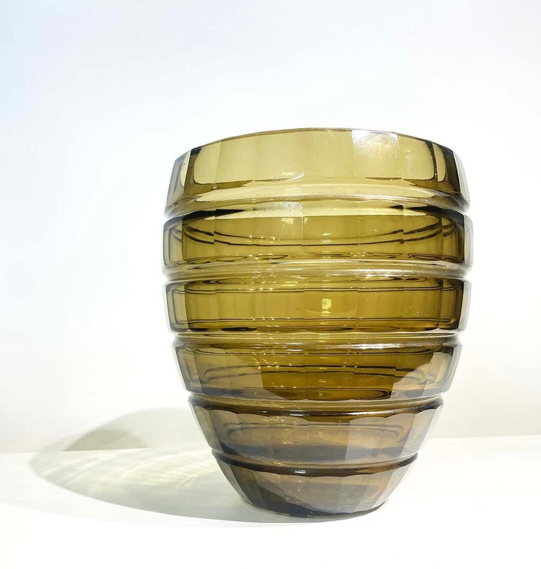 Made of Smoked glass , this beautiful Art Deco vase was realized and signed Daum Nancy in France, circa 1930
While this is a perfectly functional vase - great for displaying flowers - it is also a work of art that would be a winning addition to any