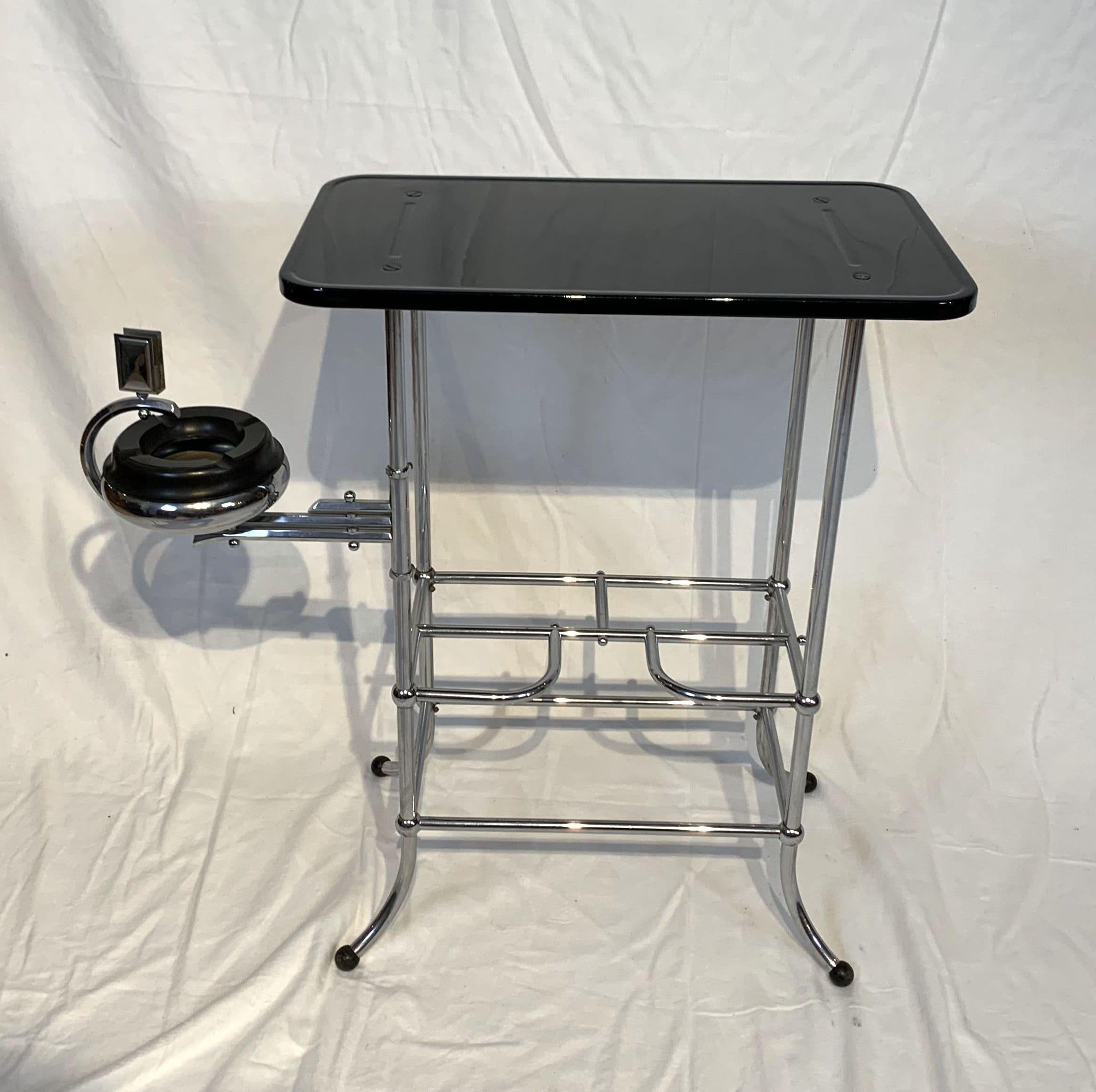 Rare original Art Deco Smoking- / Side table by Demeyere, Belgium, circa 1920

Chromed steel tube with original patina in very good condition. Black lacquered and screwed plate (original color, newly lacquered)
Turn-out ashtray with Bakelite