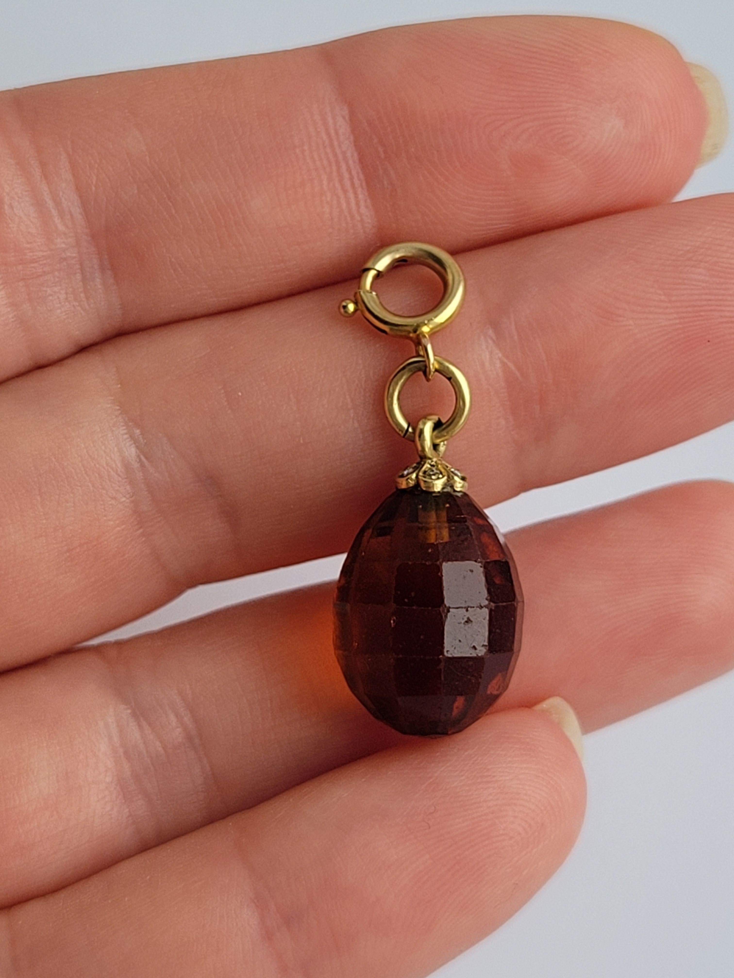 A beautiful Art Deco c.1920s Bead cut Smoky Quartz and Rose Cut Diamond pendant / Charm. The pendant complete with later 9 Carat Gold Bolt ring. Continental origin.
Total drop including bolt ring 30mm, width 10mm.
Bolt ring marked for 9 Carat