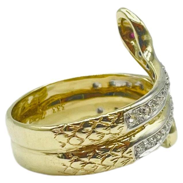 Immerse yourself in the dreamlike elegance of this Art Deco serpent ring, a captivating piece that seamlessly combines sophistication and serpentine allure. Crafted in 8k yellow gold with a pristine 8k white gold setting for the gemstones, this