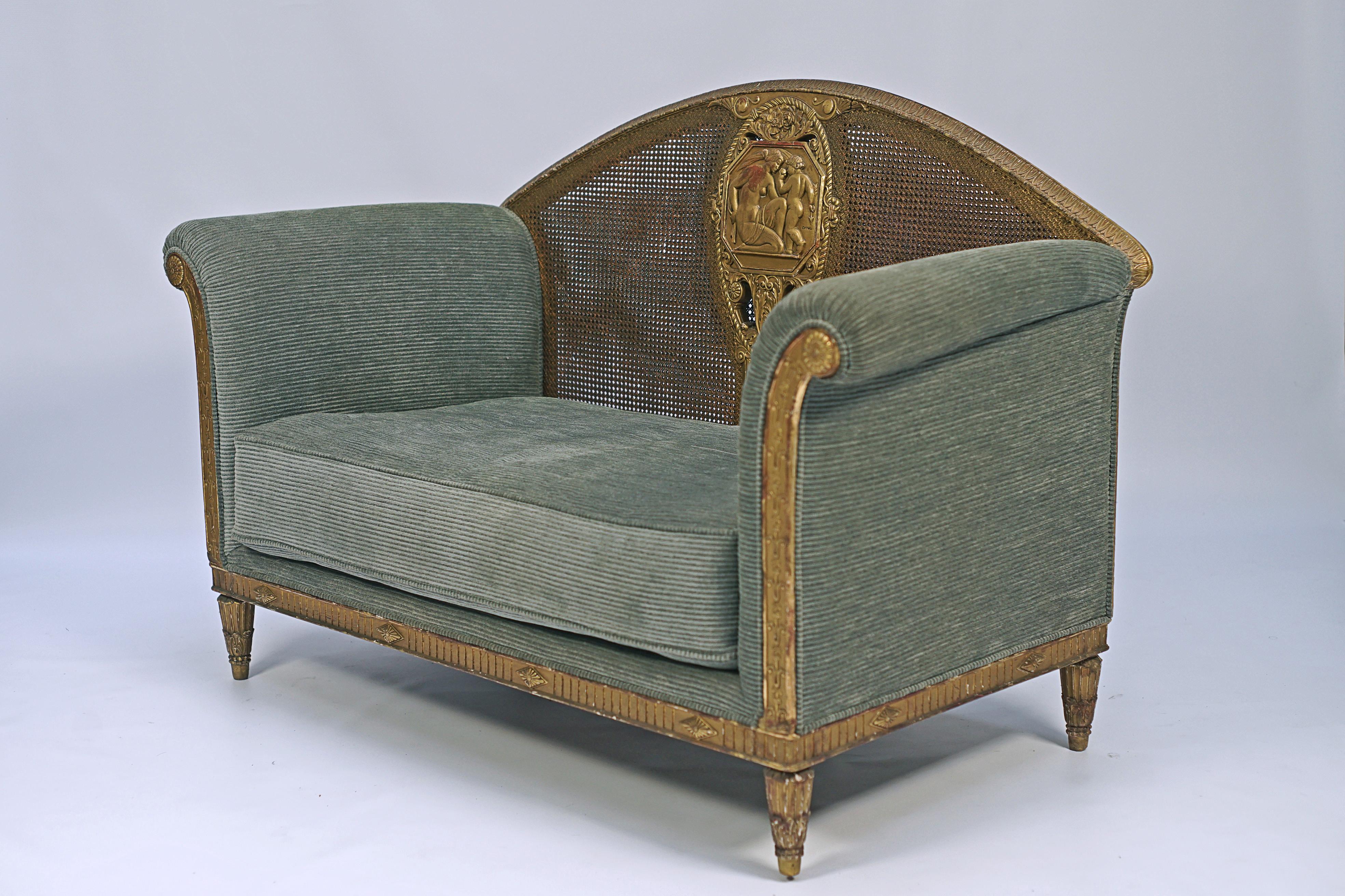 Sofa in carved and gilded wood with a curved back and double matting designed by Richard Guino (1890–1973). Central medallion representing Venus and Cupid signed 