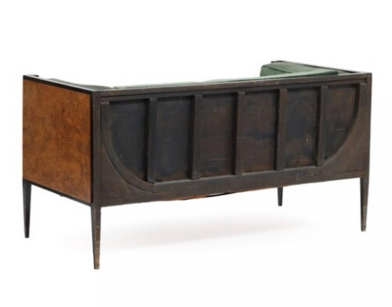 Danish cabinetmaker: Two-seat root wood and black lacquered wooden Art Deco sofa, upholstered with green velour. 1930s. L. 155 cm.

Condition :
Wear due to age and use. Marks and scratches. Upholstery with stains 