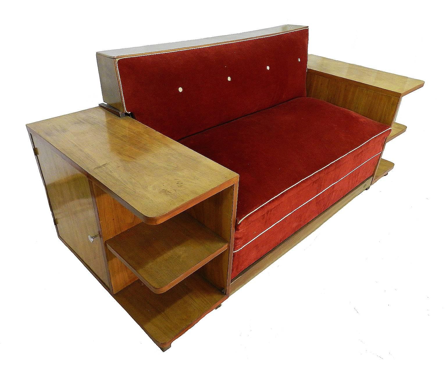 Art Deco sofa French walnut canapé bed
Sofa bed with integrated cabinets and shelves
Pale walnut good patina 
This opens up to a bed with room for a soft mattress
Dismantles for shipping and placing in situ.
Free Shipping Options available 
We will