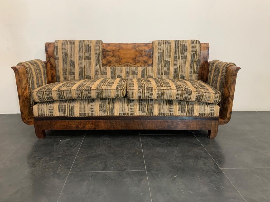 A flared goblet or lyre-shaped sofa in select walnut root. The lines echo the designs of Franco Albini, the fabrics are in the Bauhaus style. The sofa is dated 1925/30 on the back fabric replaced about 10 years after the furniture was made and