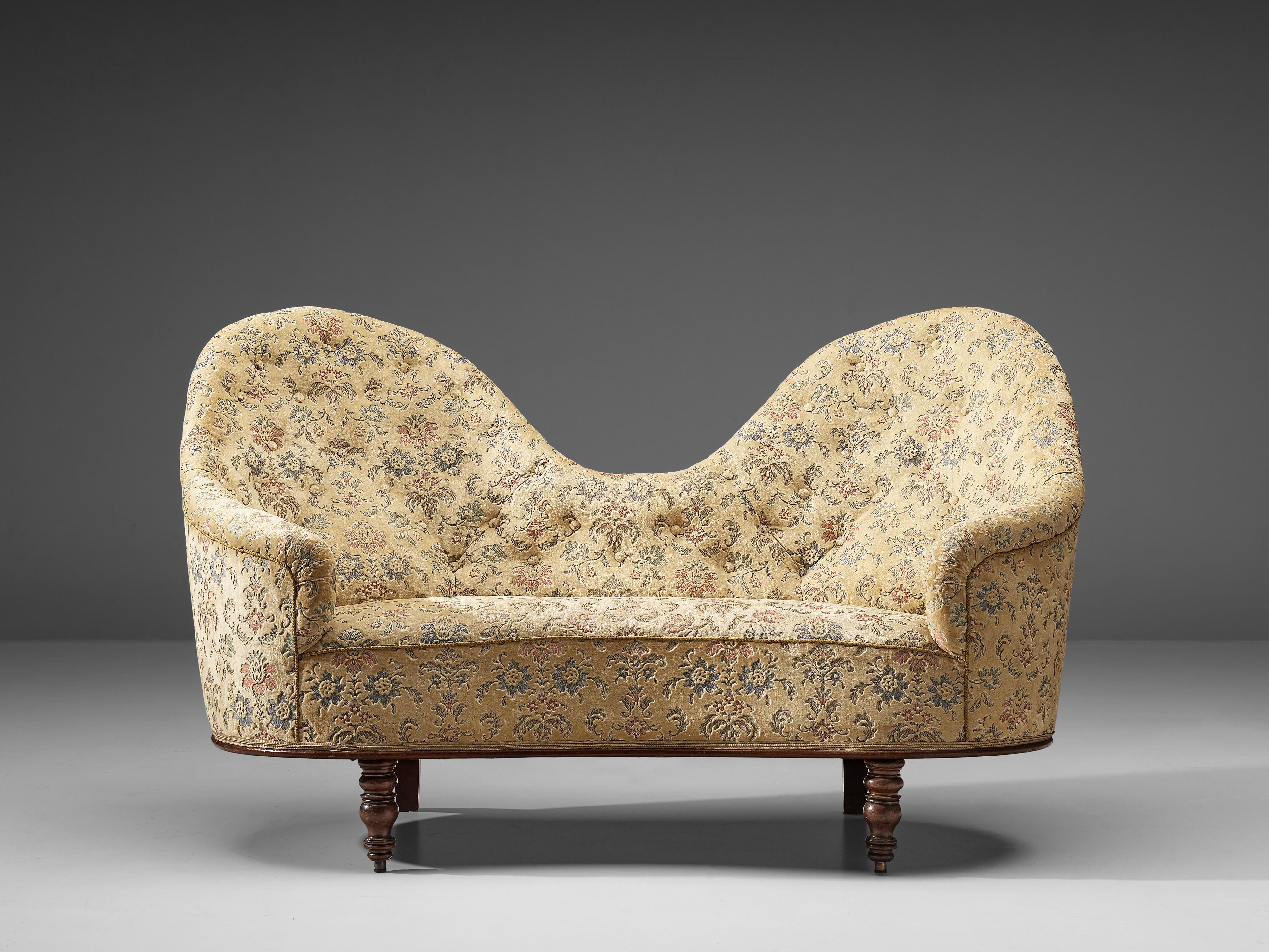 Art Deco sofa, wood, fabric, France, 1940s

This charming two-seat sofa comes with a delicate upholstery featuring a cream overtone decorated with an illustrative pattern of fauna and flora, stitched in a classic way with soft colors. Truly