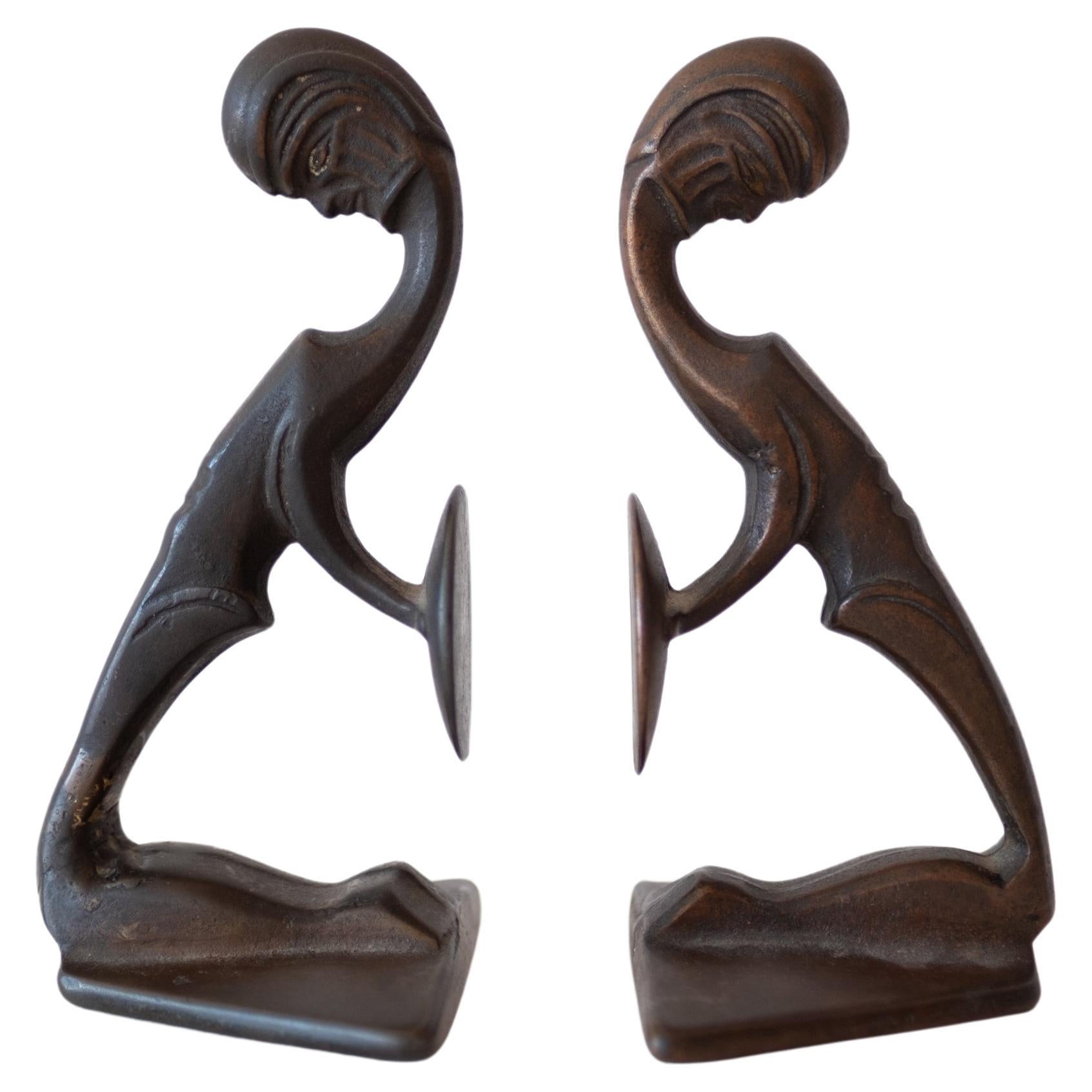Skulpturale Art-Déco-Buchstützen aus massiver Bronze im Hagenauer-Stil 