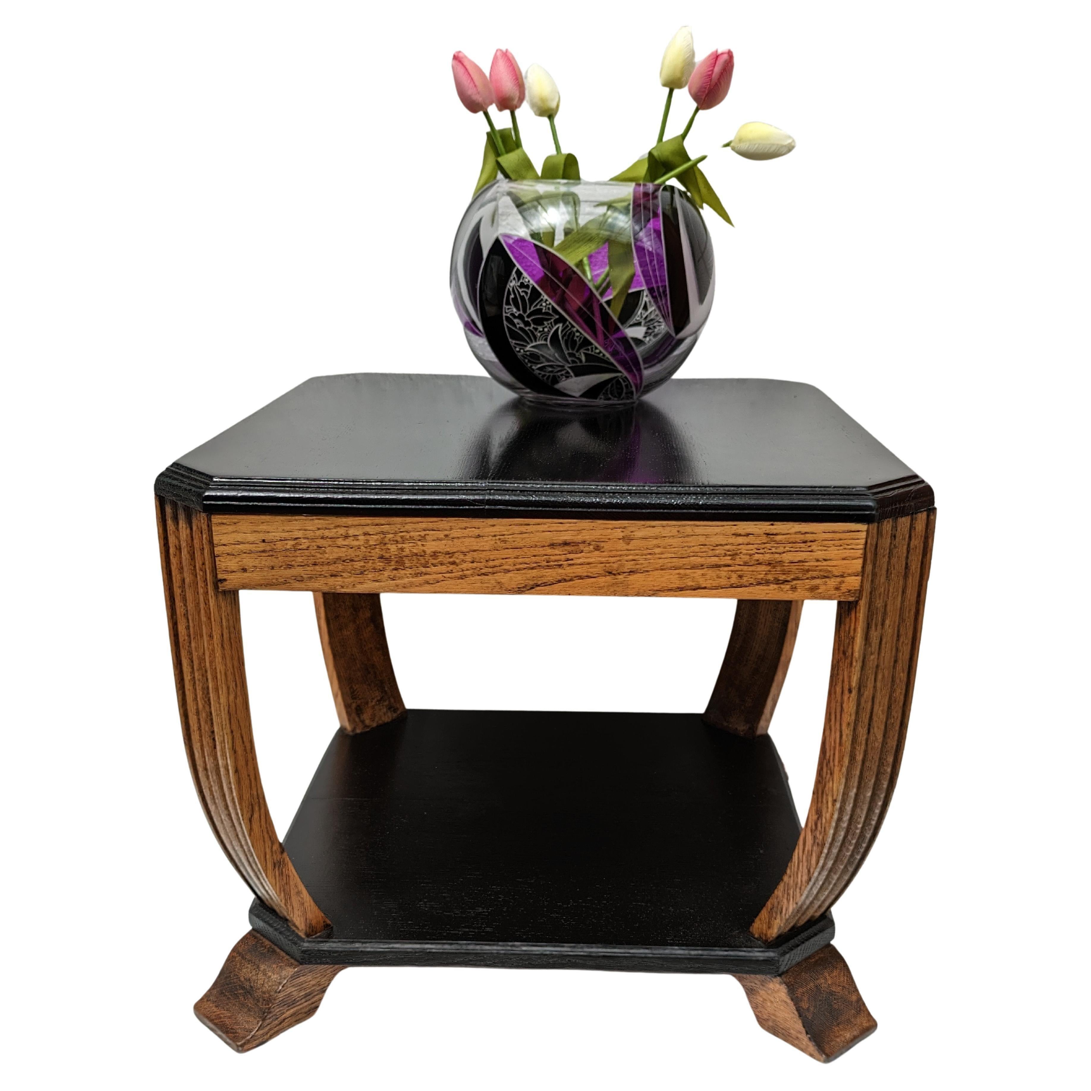 Very stylish Art Deco solid Oak table with ebonised two tier table tops dating to the 1930's. Overall shape is very appealing with reeded slightly bowed legs. Two tiered so offering plenty of space. Perfect piece to integrate with most settings.