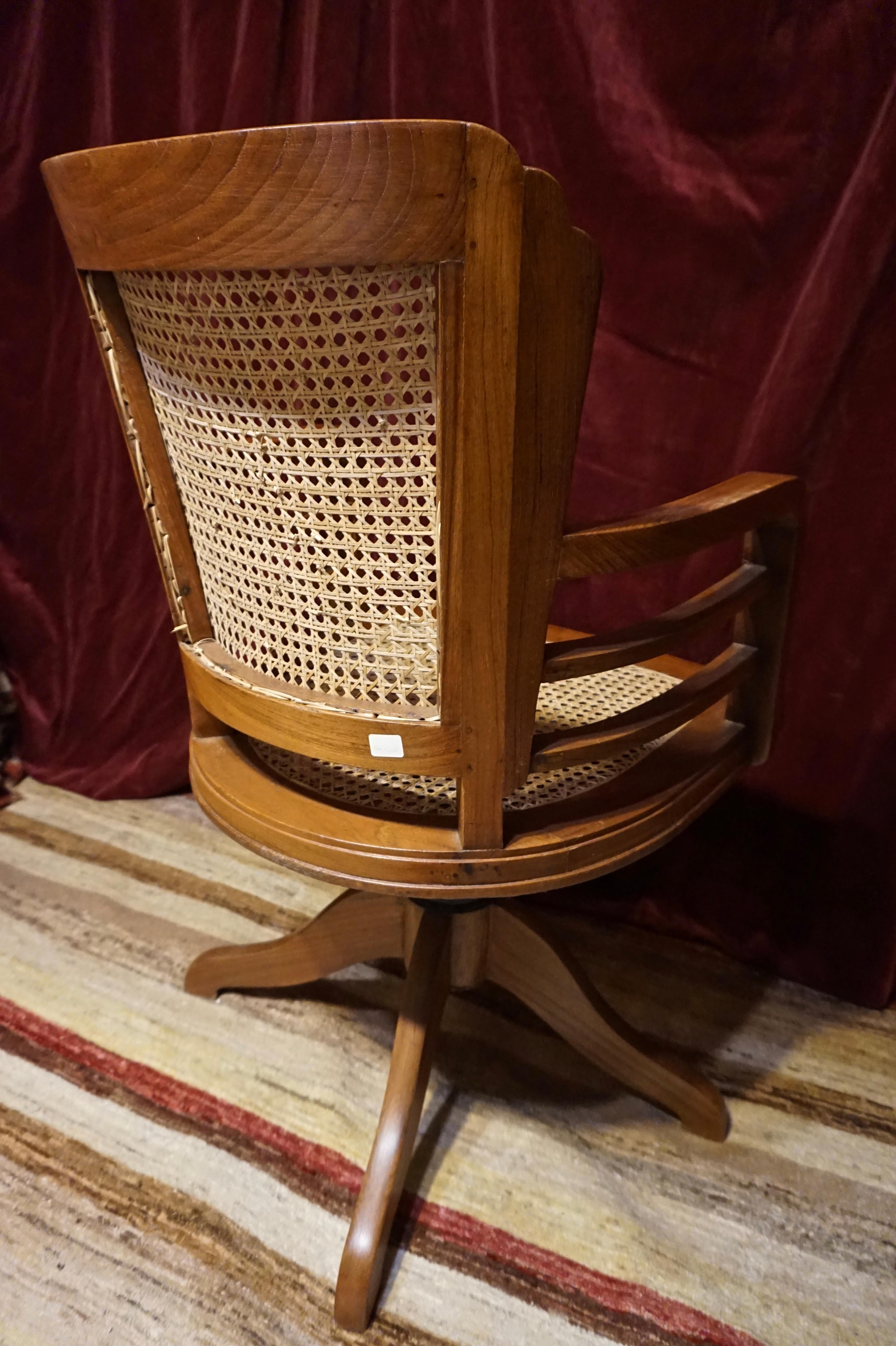 Hand-Carved Art Deco Solid Teak Revolving Chair with Cane Work & Solid Armrests