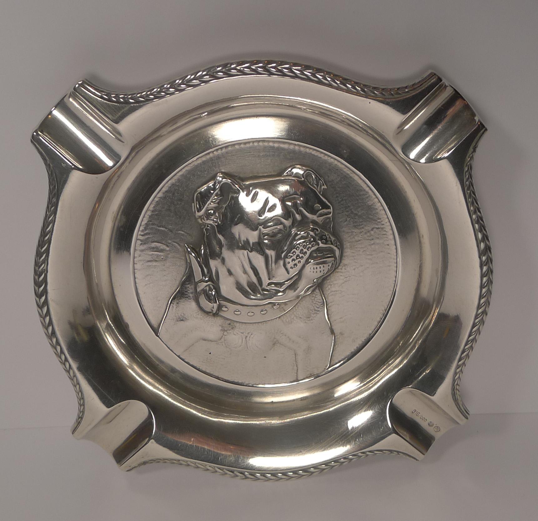 A magnificent large Spanish made silver ashtray embossed in the centre with a magnificent handsome English bulldog. 

Fully marked 916/000 in addition to the five point star for Sterling Silver (Plata De Ley). 

Art Deco in era dating to circa
