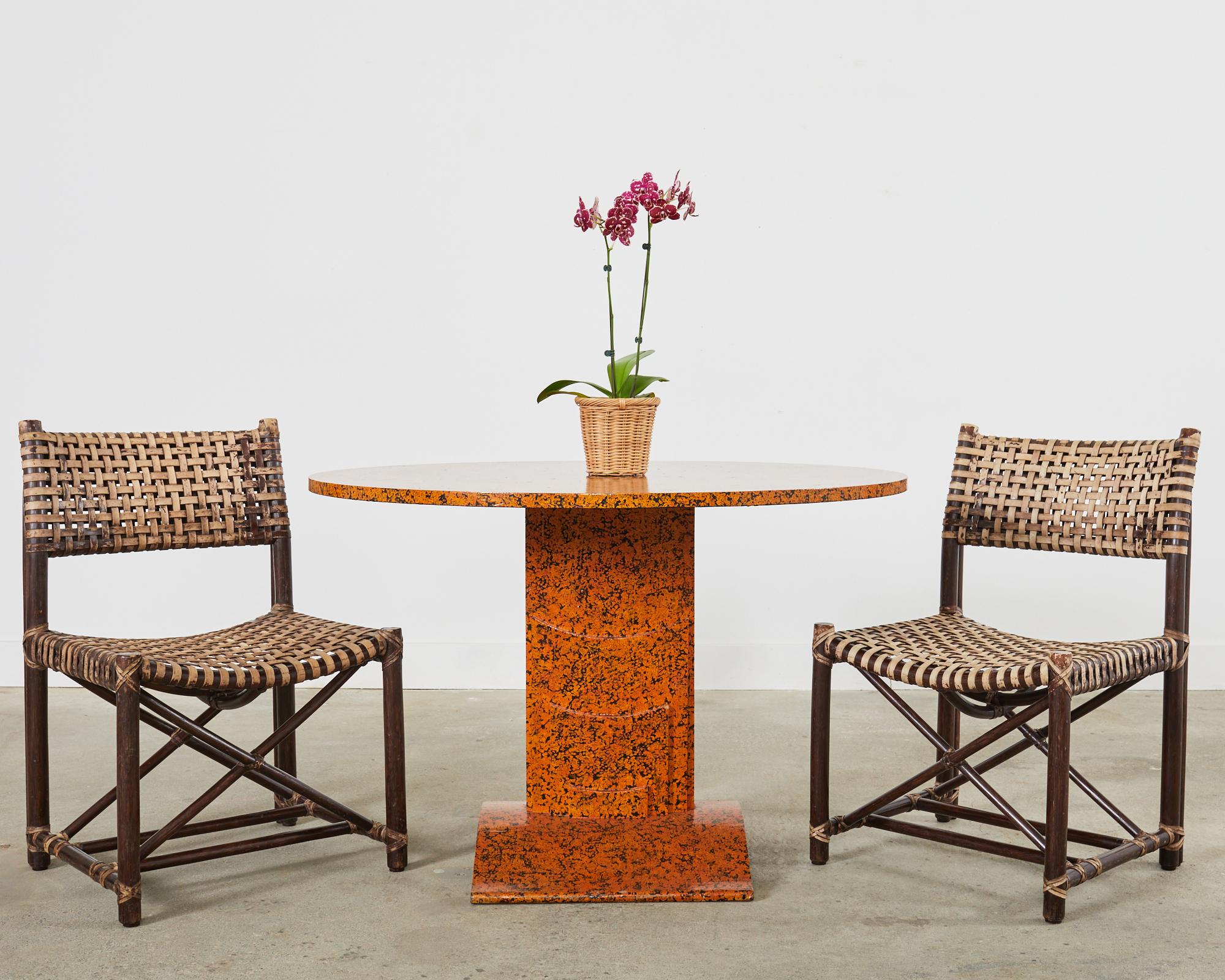 Whimsical lacquer speckled tilt-top center table or dining table by artist Ira Yeager (American 1938-2022). The table features a 1 inch thick round top that folds down. The top is supported by a sculptural pedestal ending with a curved, wide, flat
