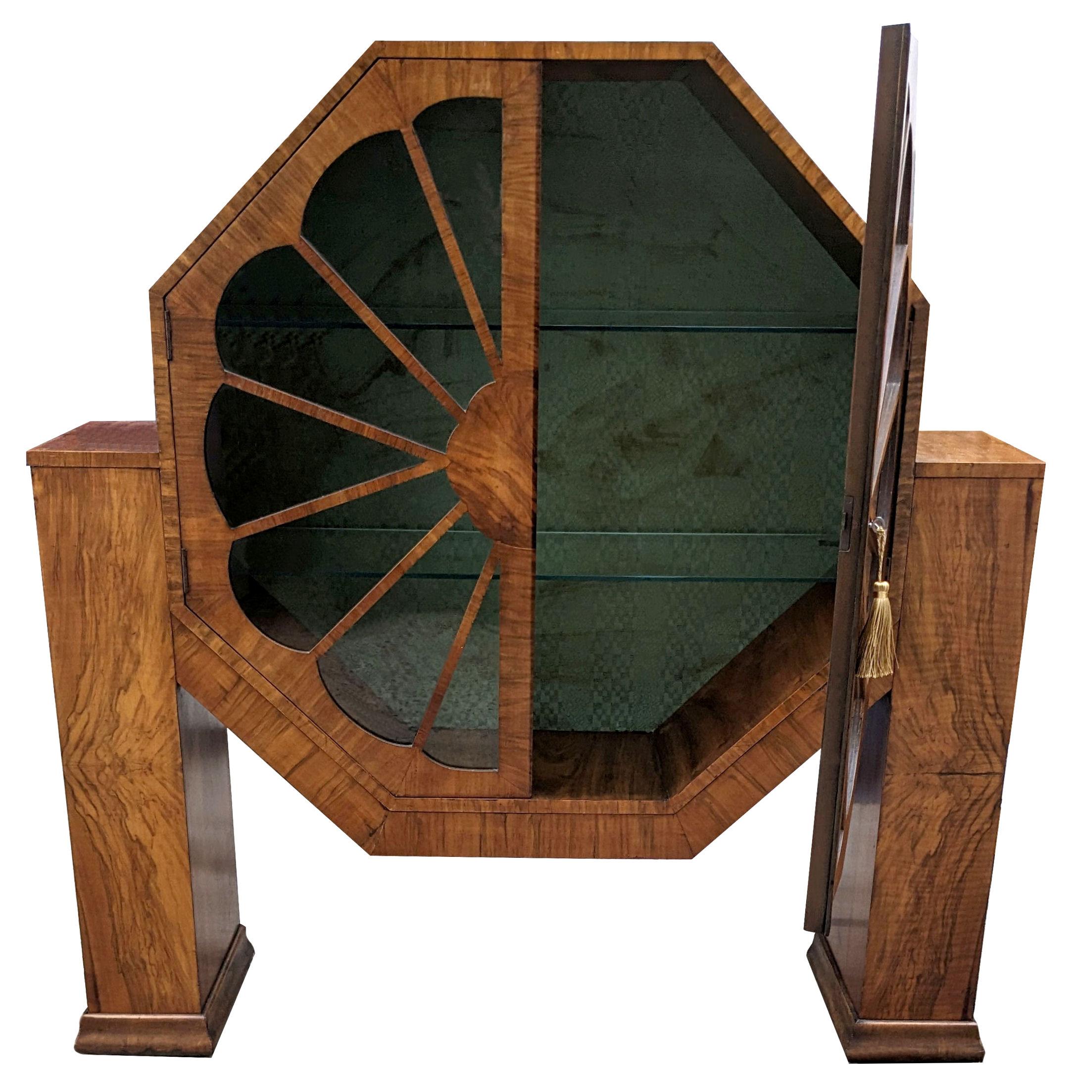 This is a fabulous opportunity to acquire a genuinely rare design Art Deco display cabinet, this being one of the best examples in figured walnut. If you want a focal point or a wow factor in a room then this is just the ticket. Not only does it