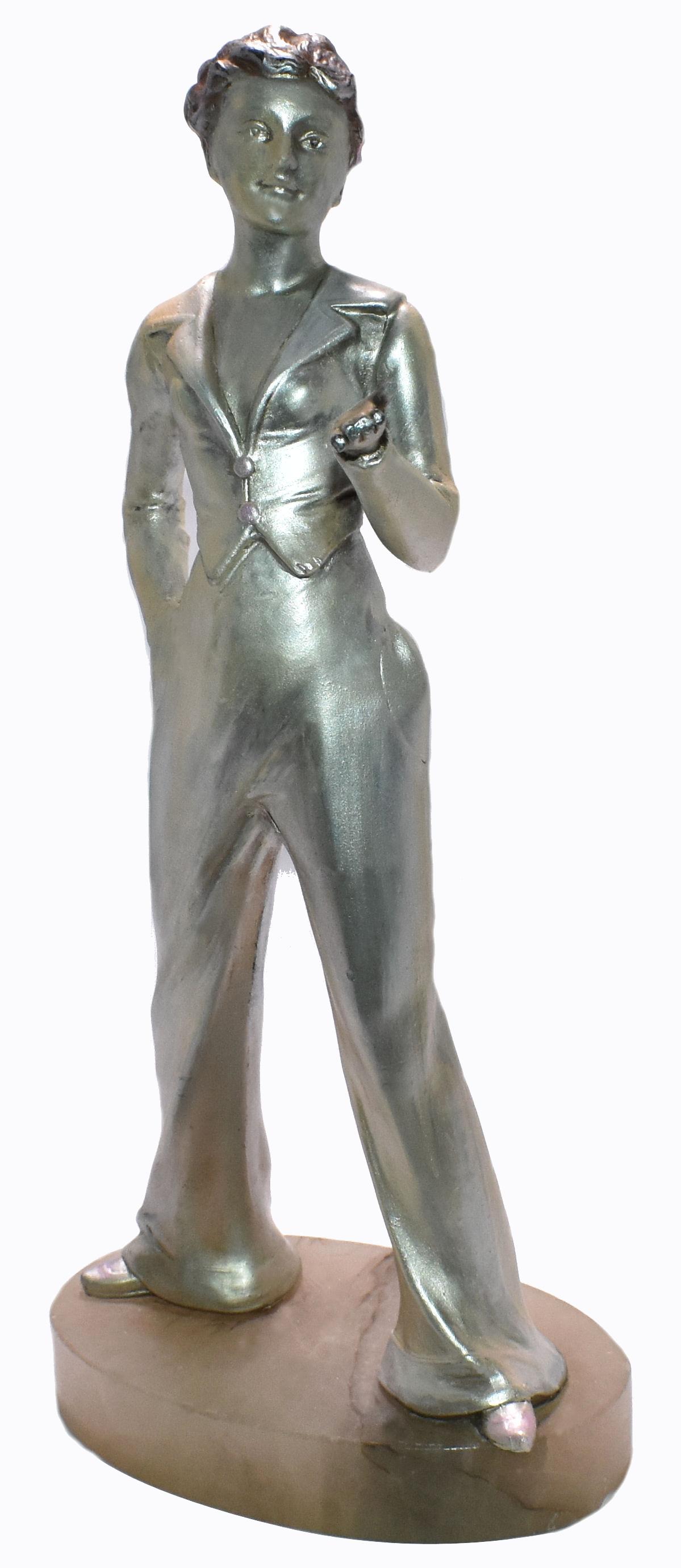 Beautifully detailed and crafted Art Deco female figure in silvered spelter dating to the 1930s. She's unsigned but attributed to Josef Lorenzl. From any angle she gracefully poses a movement. Her condition is very good with minimal signs indicating