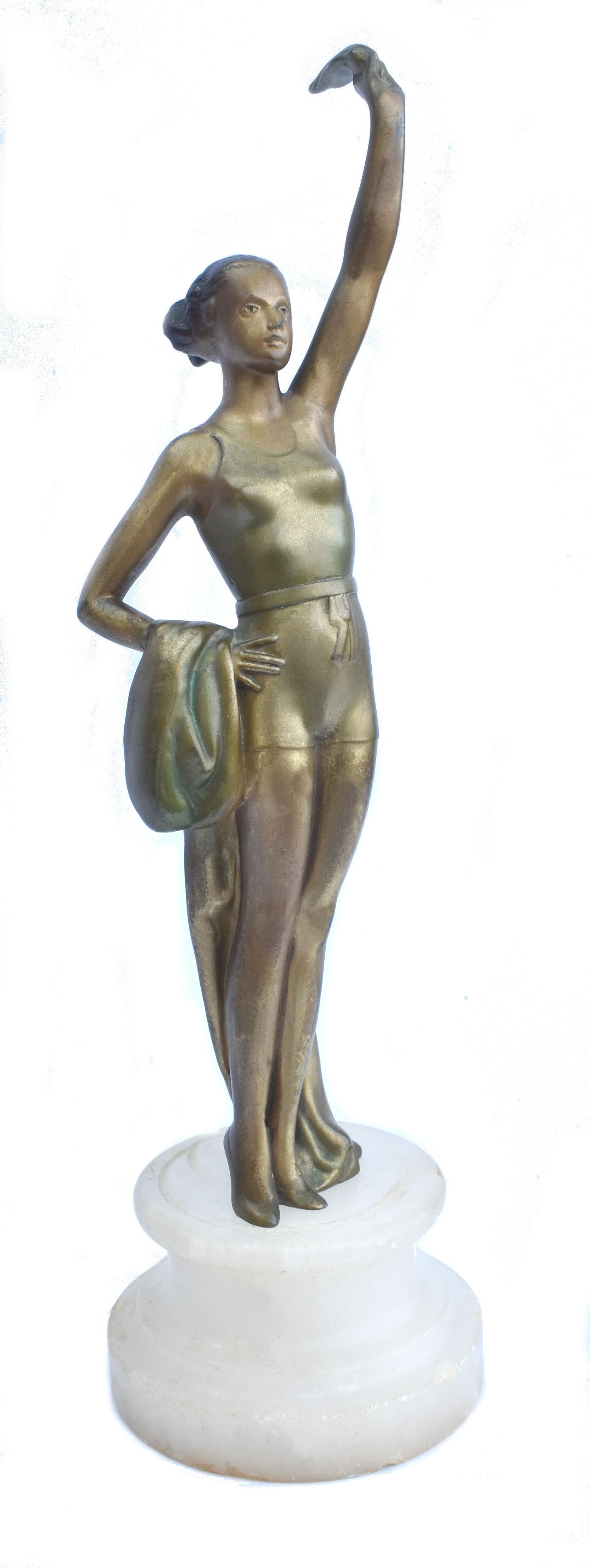 For your consideration is this very attractive and original Art Deco cold painted Spelter figurine of a swimmer, holding a large plume in her outstretched hand and a draped shawl/ towel over her other arm. She stands an impressive 13 inches high