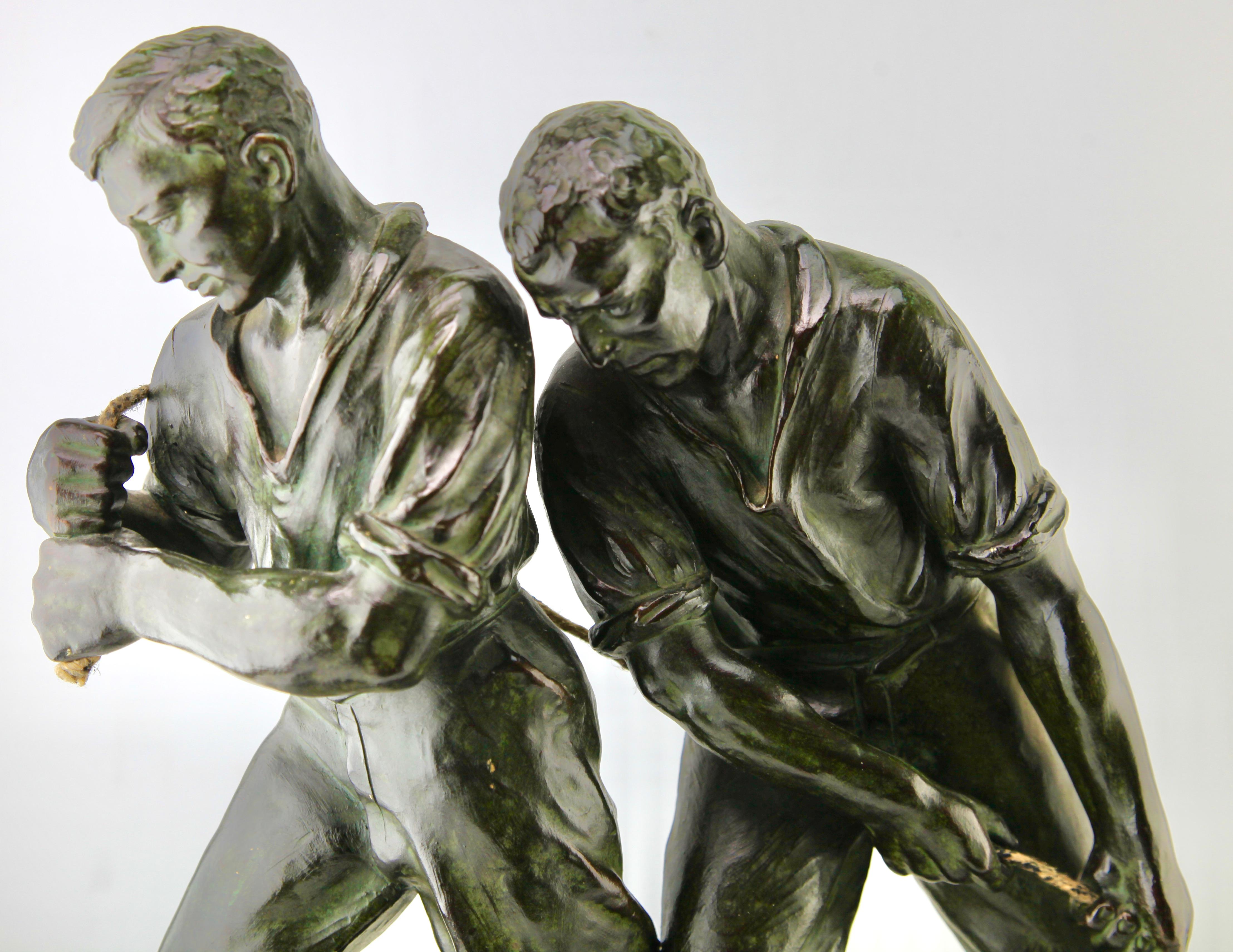 Early 20th Century Art Deco Spelter Sculpture, Two Men Pulling a Boat from the Water Signed G Carli For Sale