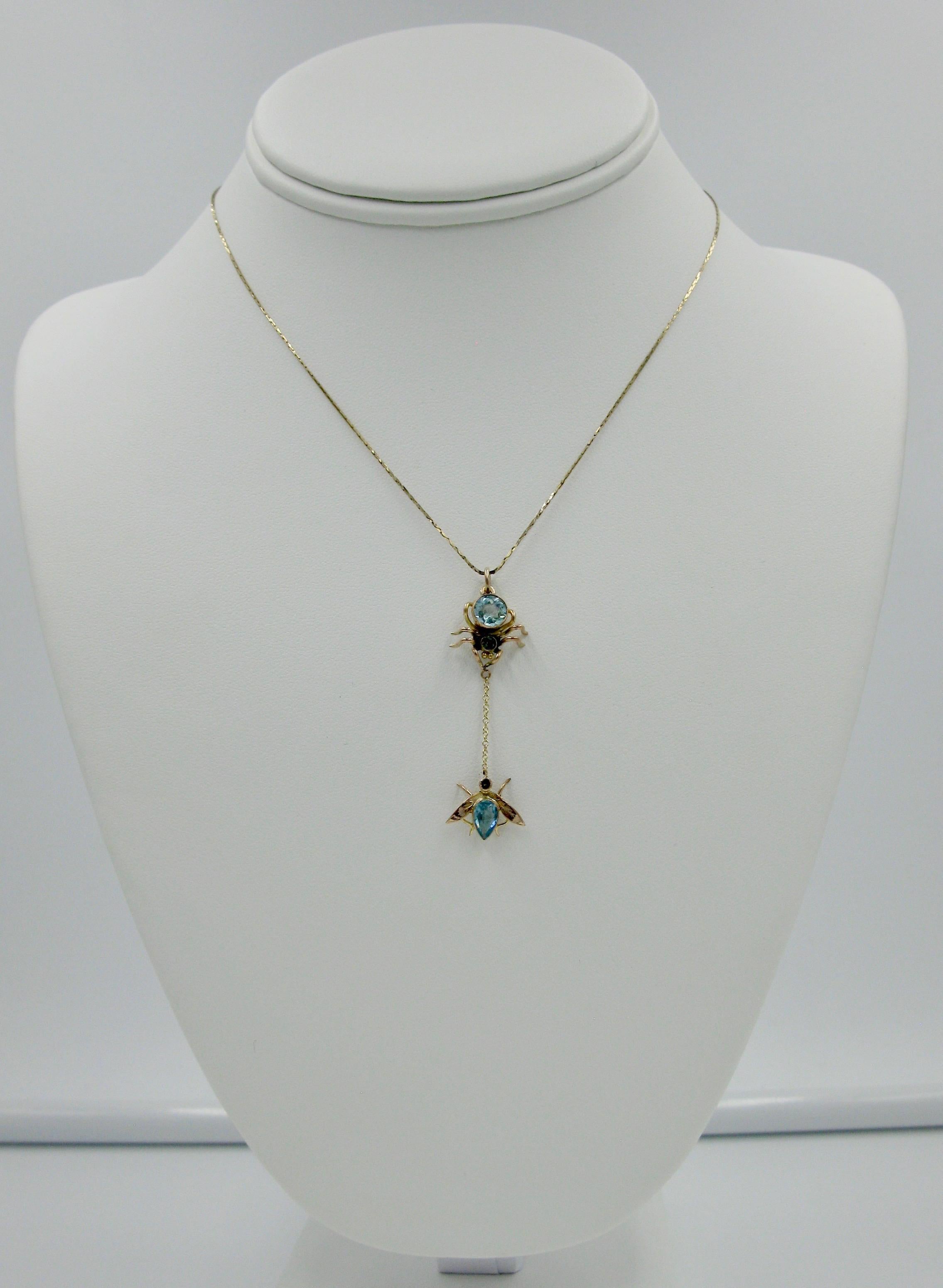 A wonderful Spider and Fly Pendant set with fine Blue Topaz gems!  The gorgeous spider is set with two round faceted Blue Topaz.  The fly is set with a faceted pear shape and round Blue Topaz.  The jewels are set in 9 Carat Gold.  The spider and fly