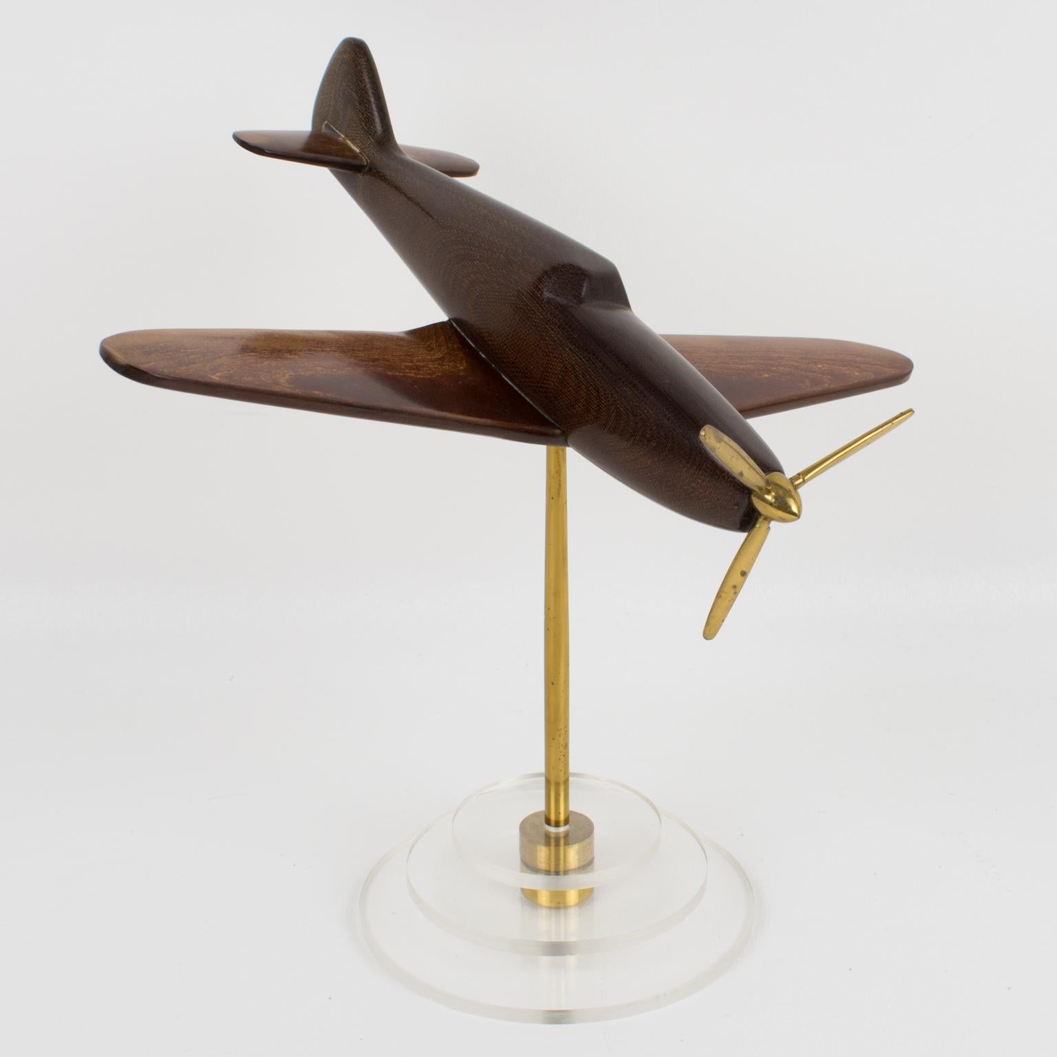 A stunning Art Deco early Bakelite sculpture aviation model featuring a Spitfire airplane. The Bakelite quality used for this airplane is a rare early quality where other materials like fabric or wood dust were added to the mixture to solidify the